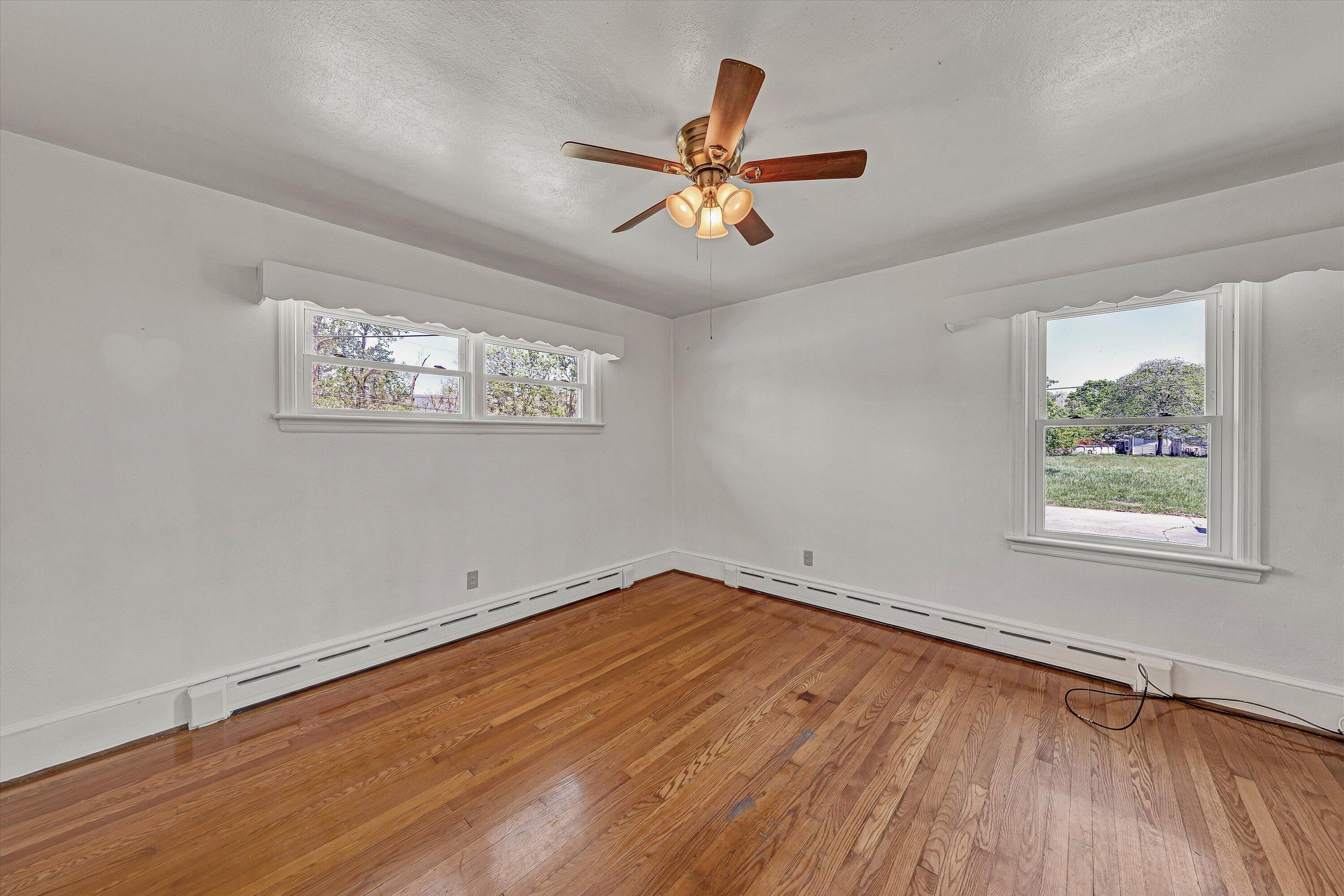 2356 West Riverside Drive Salem, VA 24153 - Photo 14 of 18 wooden floor in an empty room with a window