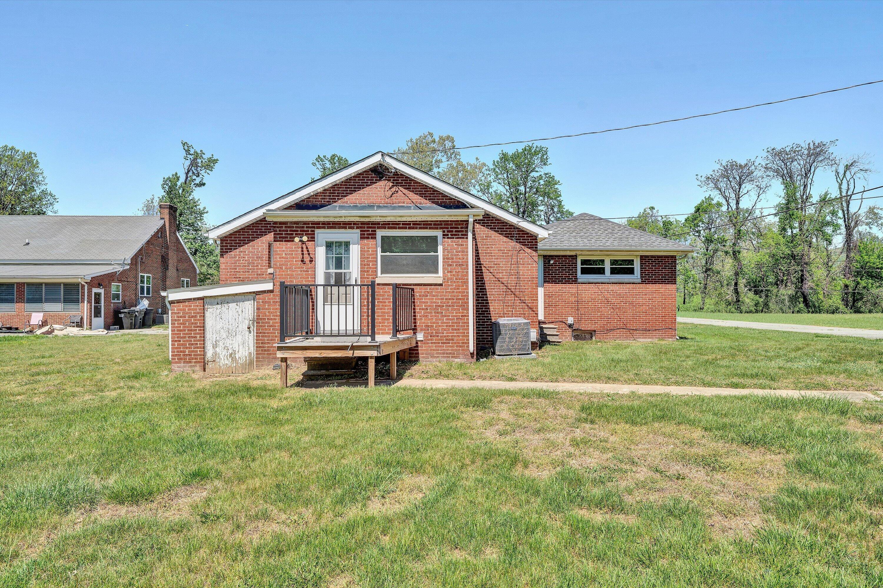 2356 West Riverside Drive Salem, VA 24153 - Photo 17 of 18 a front view of a house with a yard