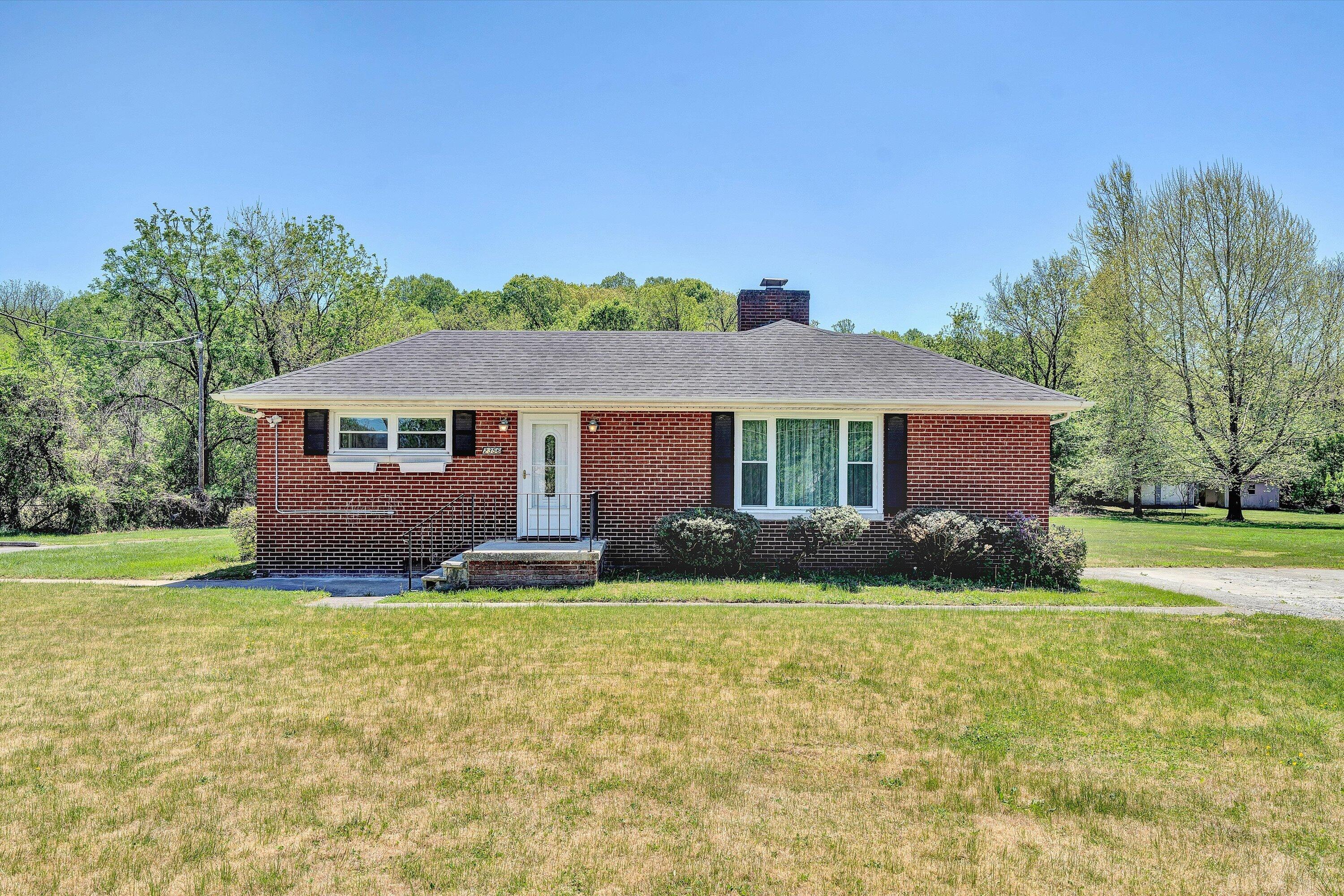 2356 West Riverside Drive Salem, VA 24153 - Photo 2 of 18 a view of house with yard and green space