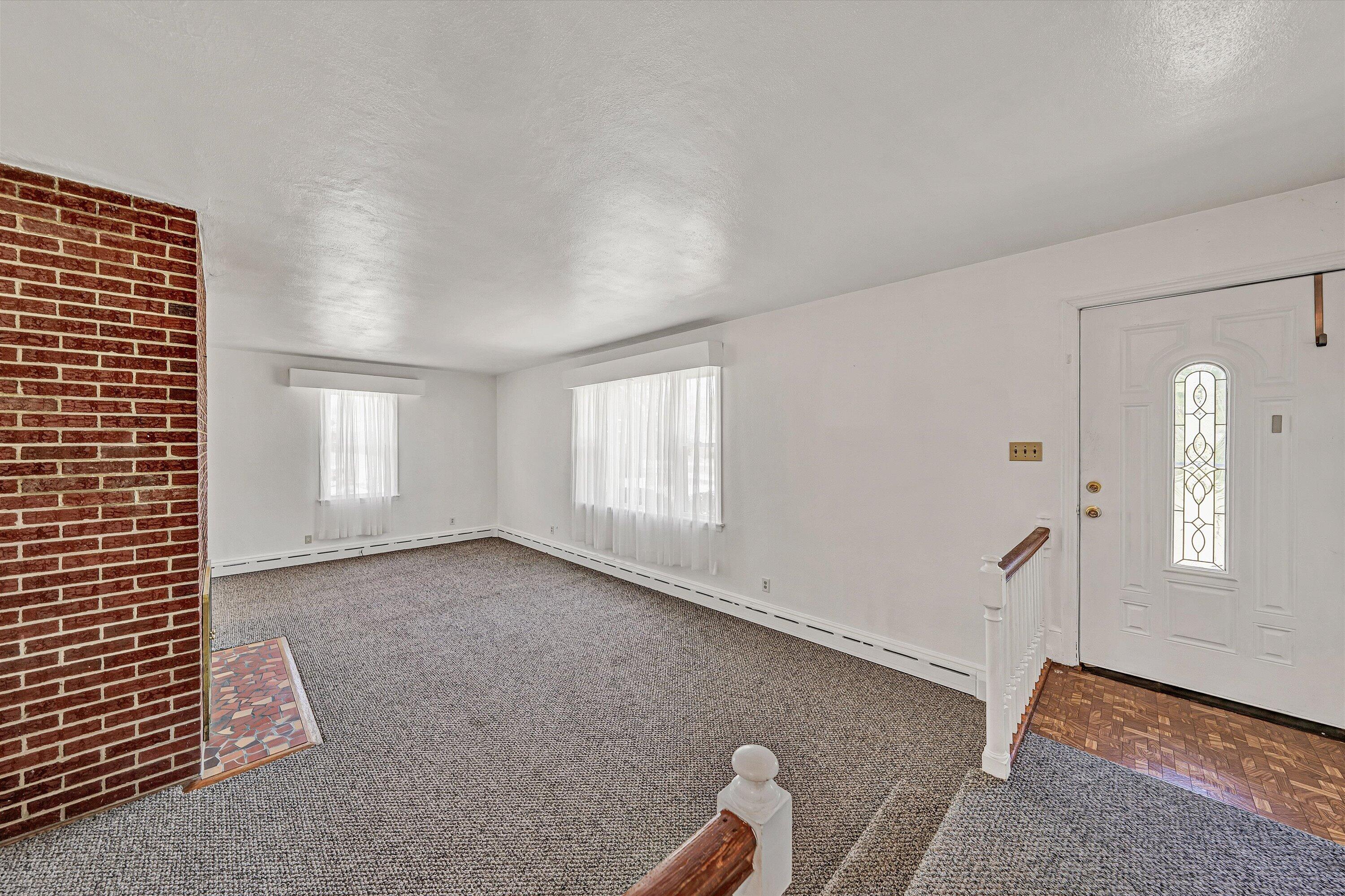 2356 West Riverside Drive Salem, VA 24153 - Photo 3 of 18 an empty room with windows