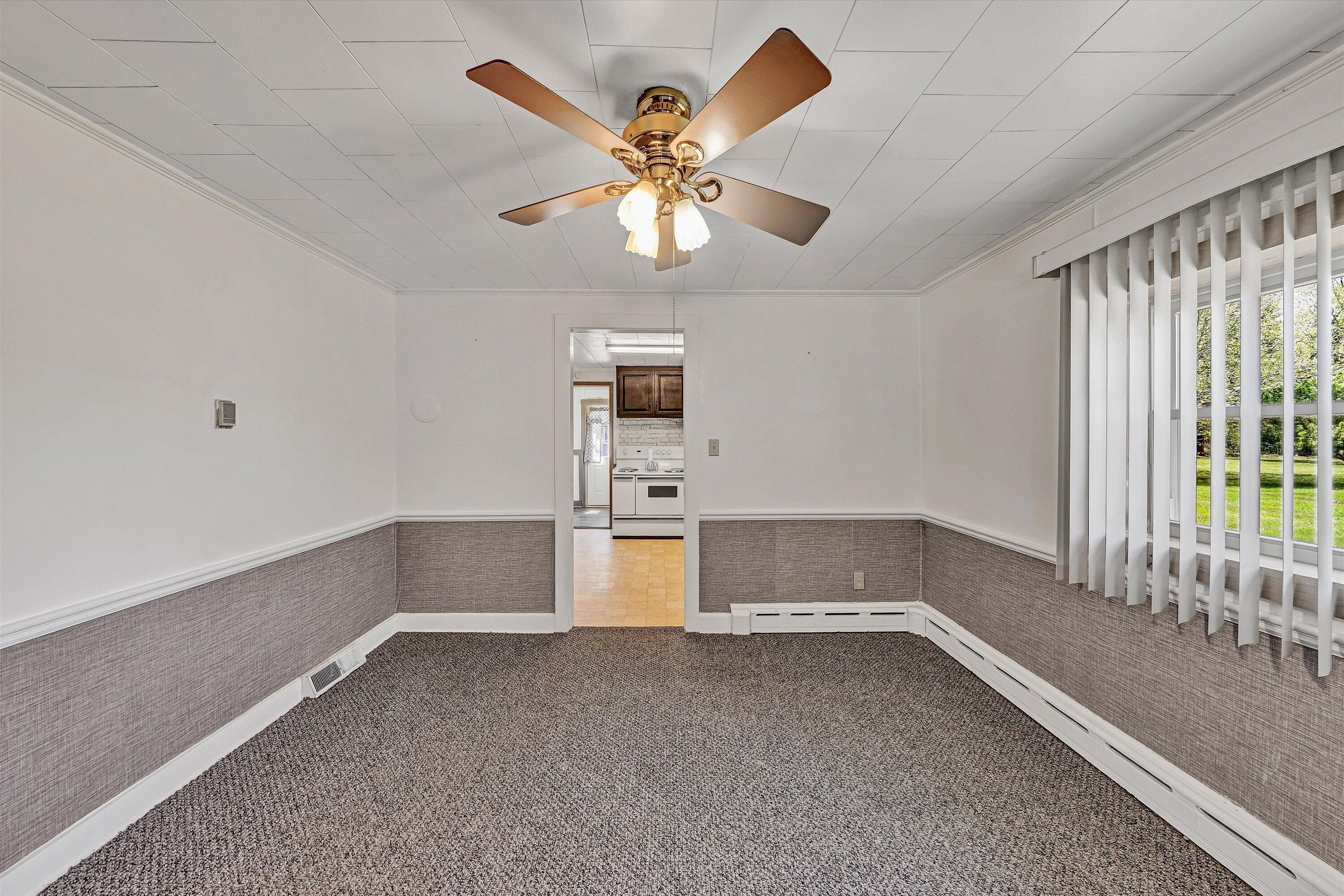 2356 West Riverside Drive Salem, VA 24153 - Photo 5 of 18 wooden floor in an empty room with a window