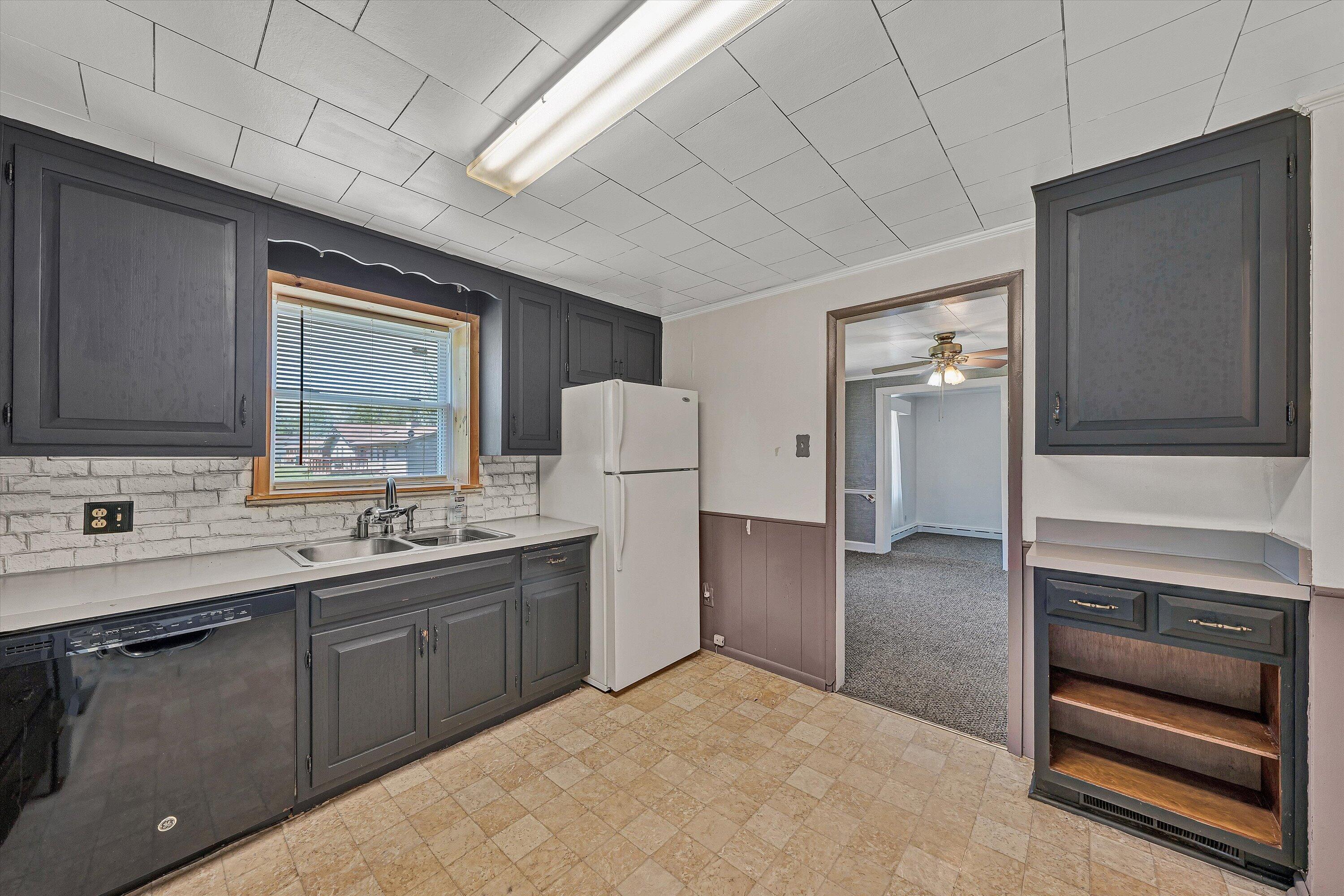 2356 West Riverside Drive Salem, VA 24153 - Photo 8 of 18 a kitchen with a sink and refrigerator