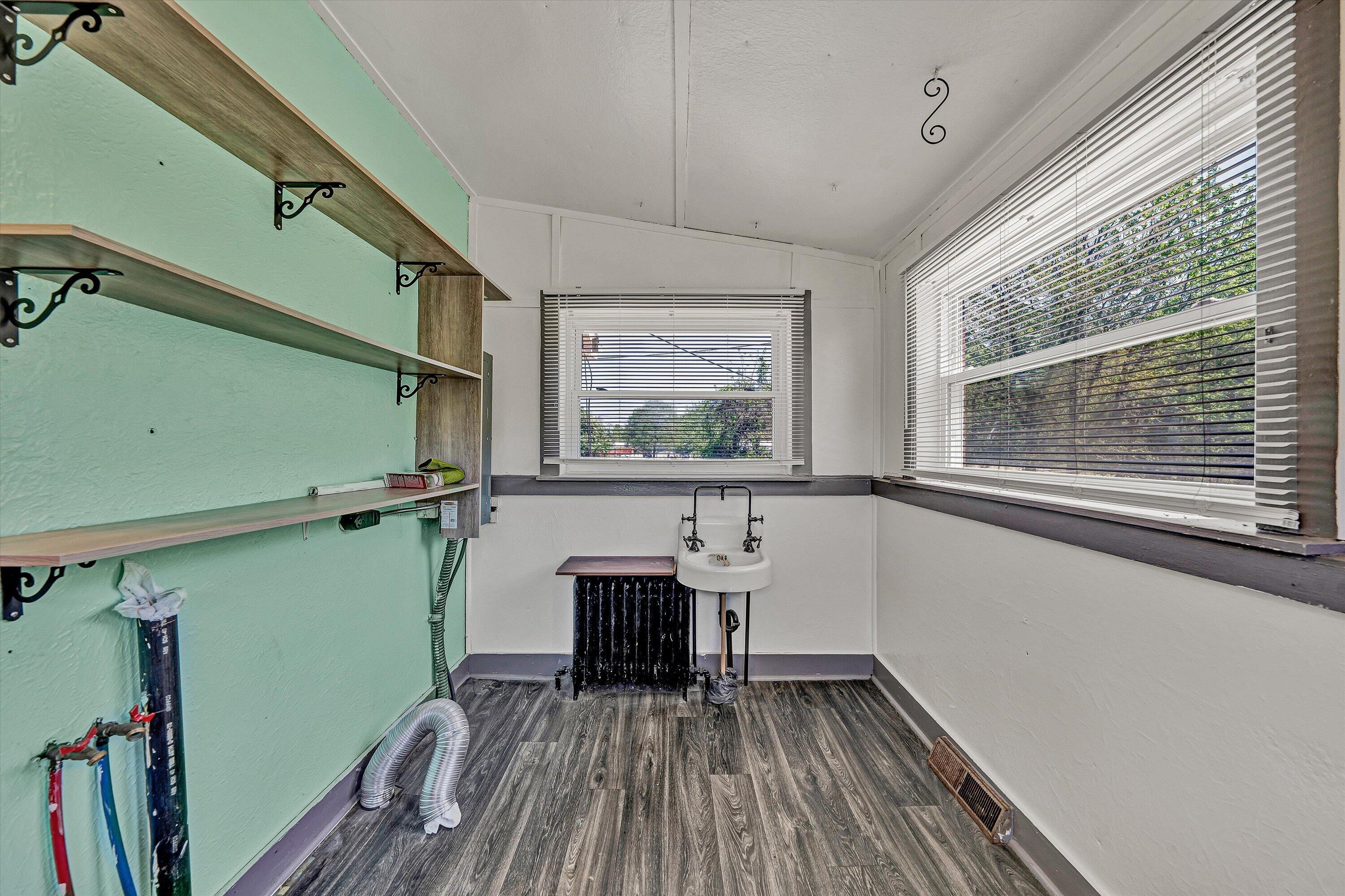2356 West Riverside Drive Salem, VA 24153 - Photo 9 of 18 a view of a room with window wooden floor and fan
