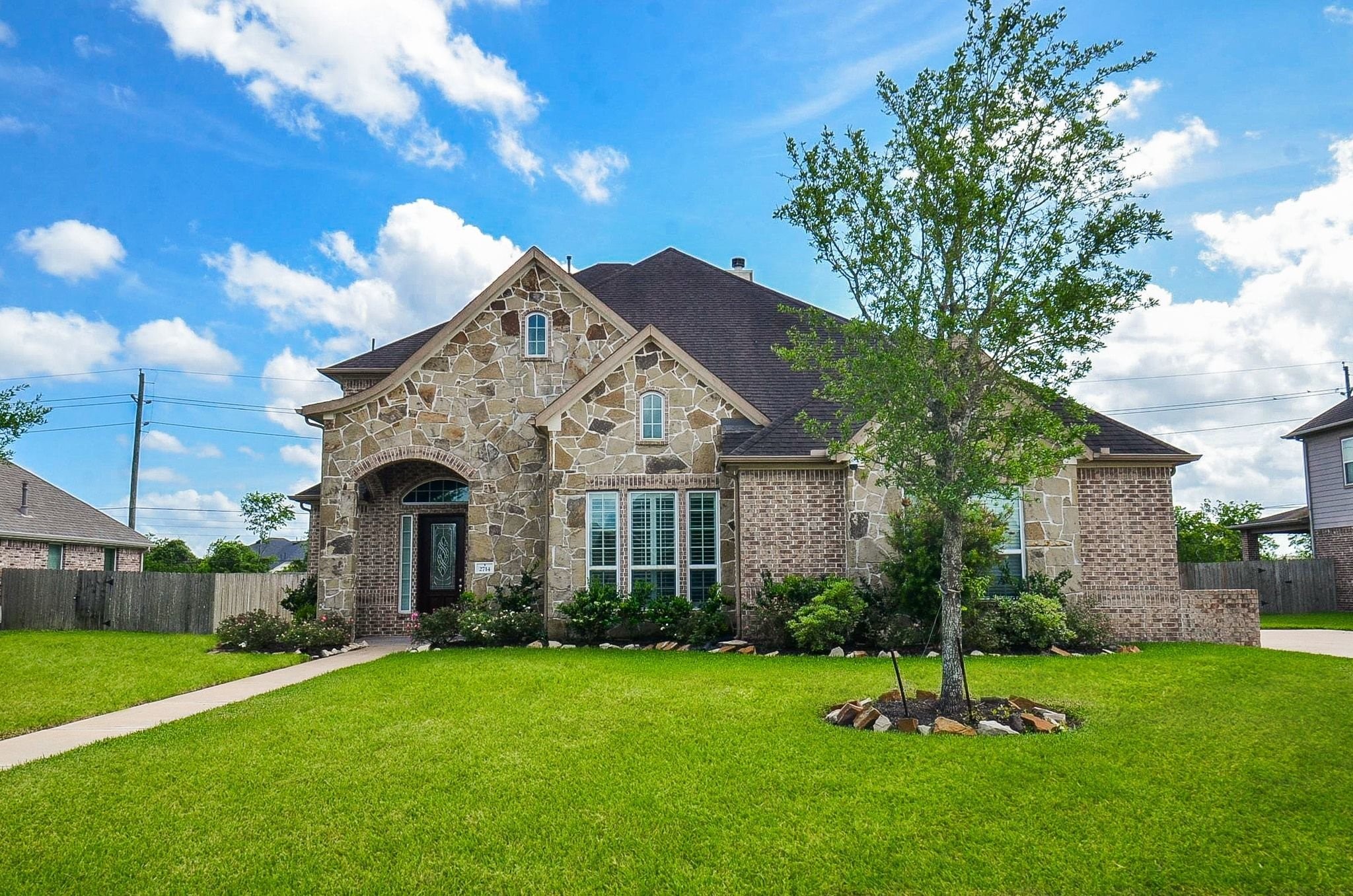 2714 Topaz Cove Lane Rosharon, TX 77583 - Photo 2 of 50 a front view of a house with a yard