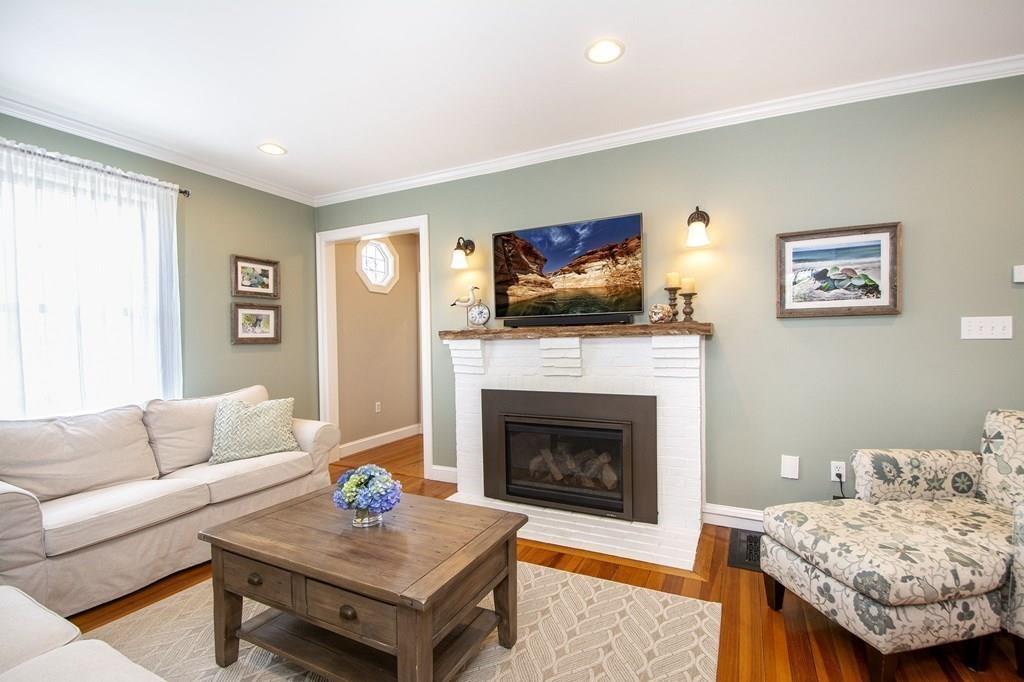 37 Damon Road Scituate, MA 02066 - Photo 17 of 39 a living room with furniture and a fireplace