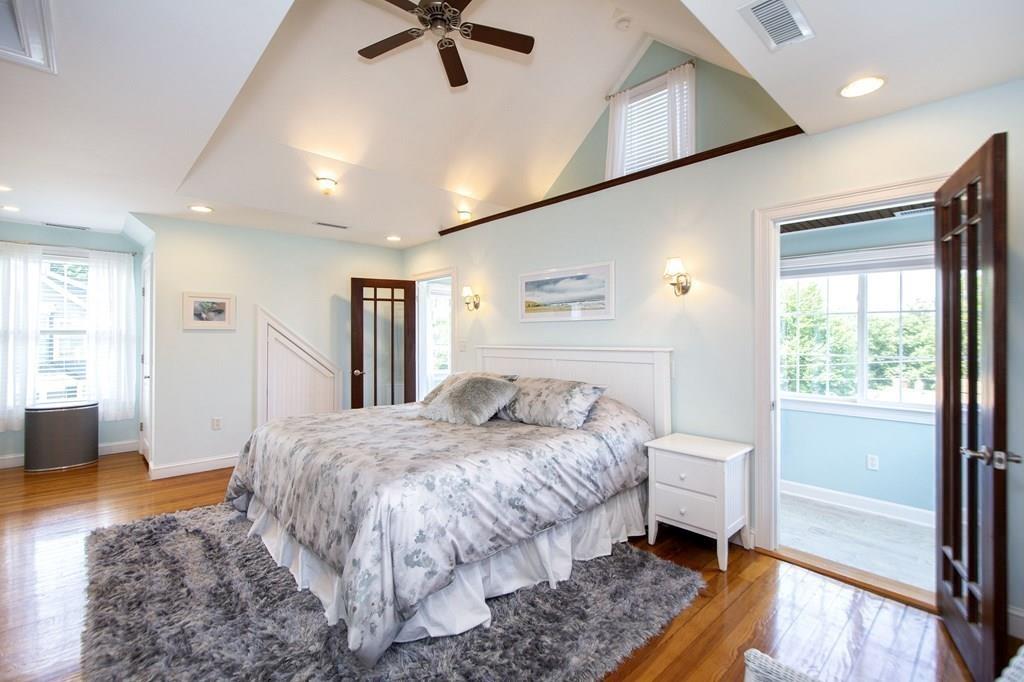37 Damon Road Scituate, MA 02066 - Photo 20 of 39 a spacious bedroom with a bed and a dresser next to a window