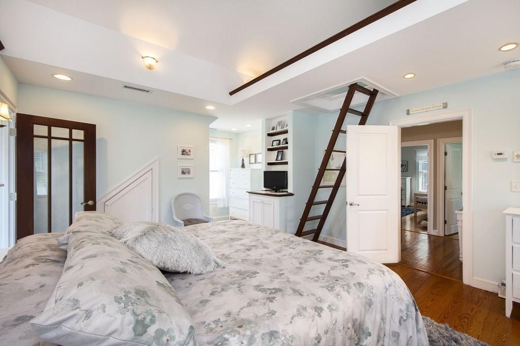 37 Damon Road Scituate, MA 02066 - Photo 23 of 39 a bedroom with a large bed and a large mirror