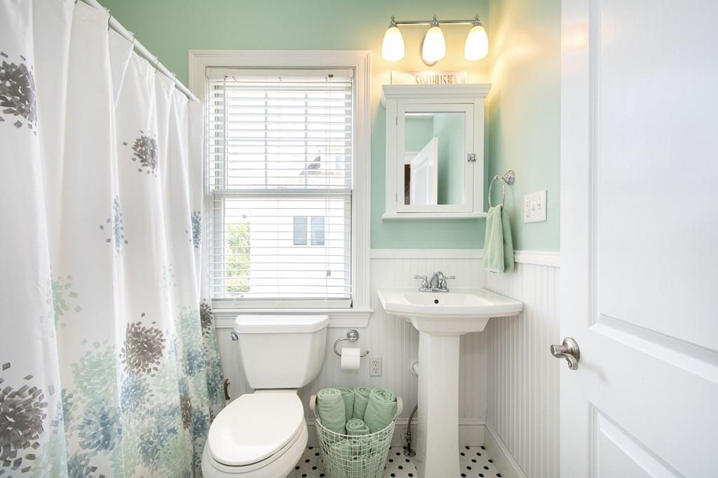 37 Damon Road Scituate, MA 02066 - Photo 29 of 39 a bathroom with a sink mirror and a toilet