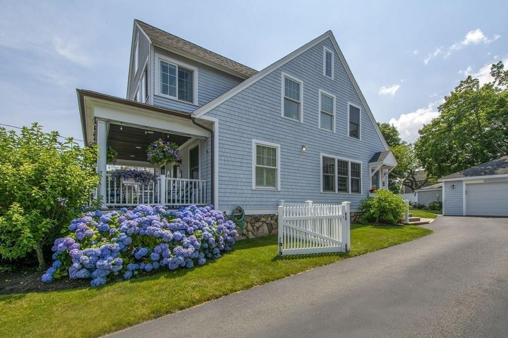 37 Damon Road Scituate, MA 02066 - Photo 34 of 39 a front view of a house with a garden and plants