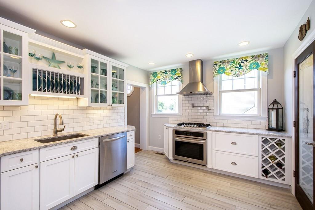 37 Damon Road Scituate, MA 02066 - Photo 5 of 39 a kitchen with granite countertop a sink stainless steel appliances and window
