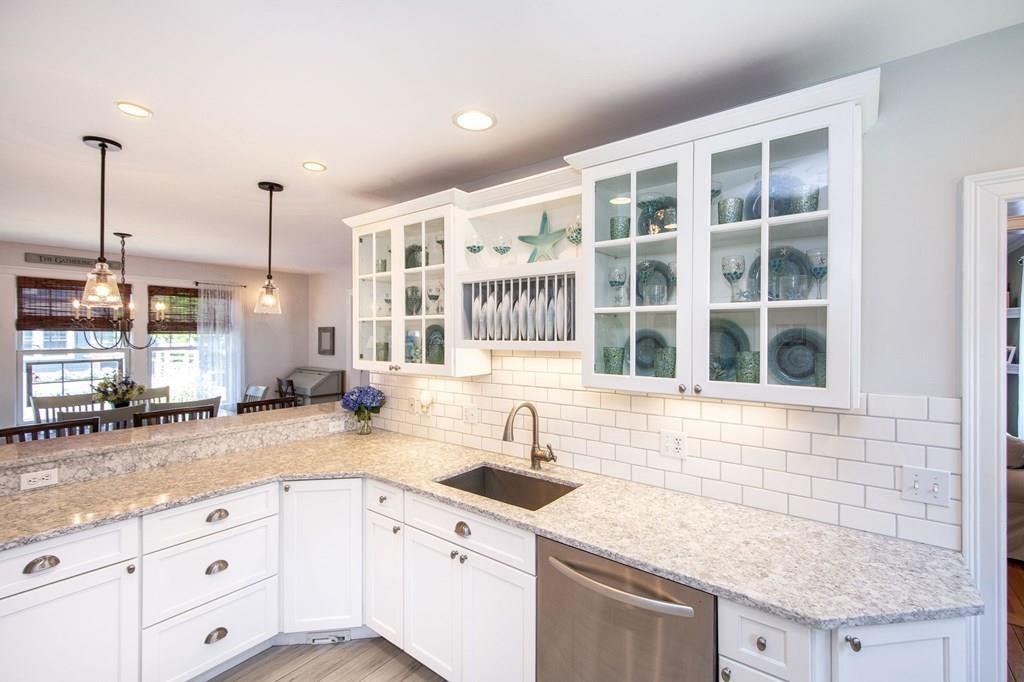 37 Damon Road Scituate, MA 02066 - Photo 9 of 39 a kitchen with granite countertop a sink and white cabinets