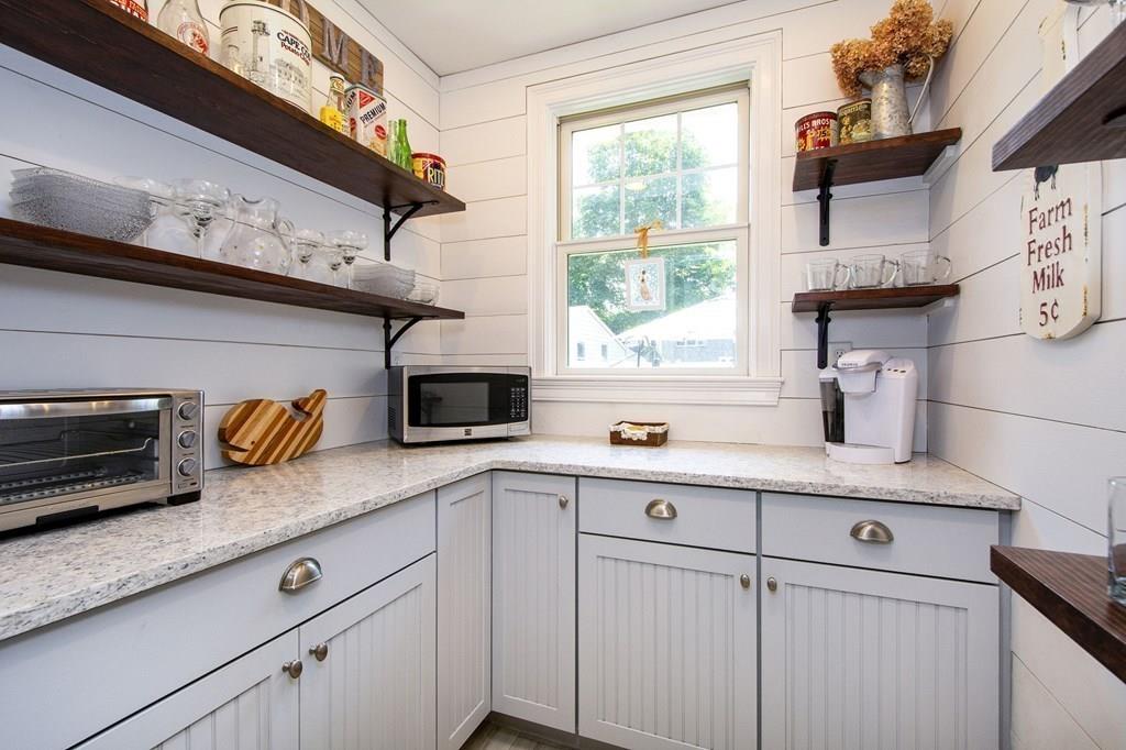 37 Damon Road Scituate, MA 02066 - Photo 10 of 39 a kitchen with stainless steel appliances granite countertop a sink a stove and cabinets