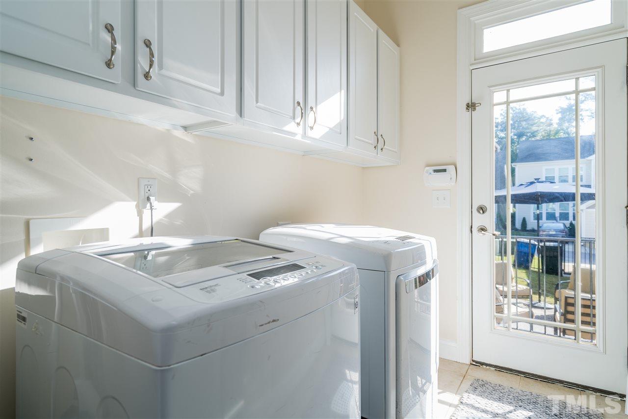 1528 Rodessa Run Raleigh, NC 27607 - Photo 17 of 30 Light filled laundry room downstairs is a great entrance to the backyard.