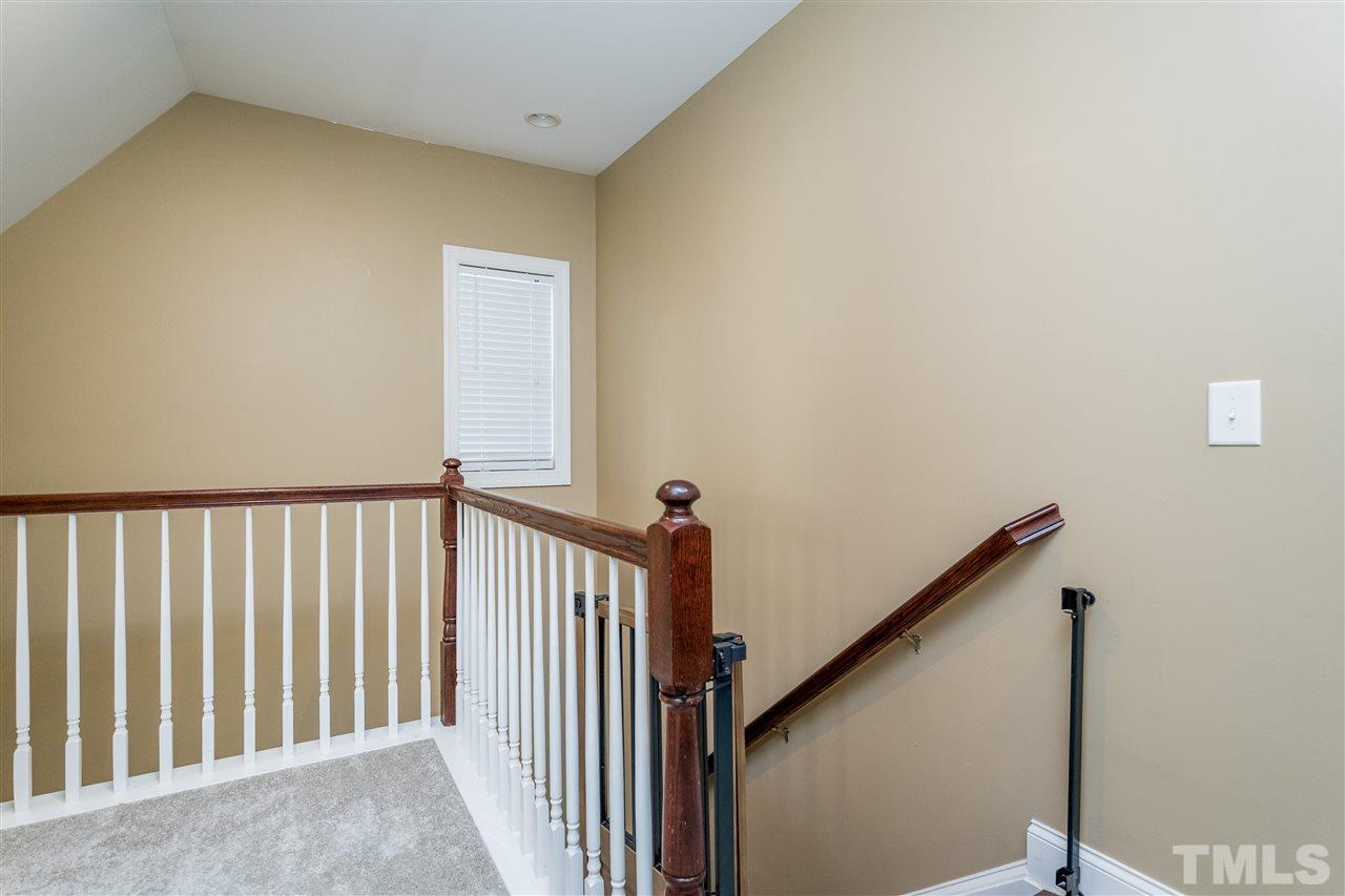 1528 Rodessa Run Raleigh, NC 27607 - Photo 18 of 30 New upstairs carpet is plush and surrounds the open picket staircase as you come upstairs.