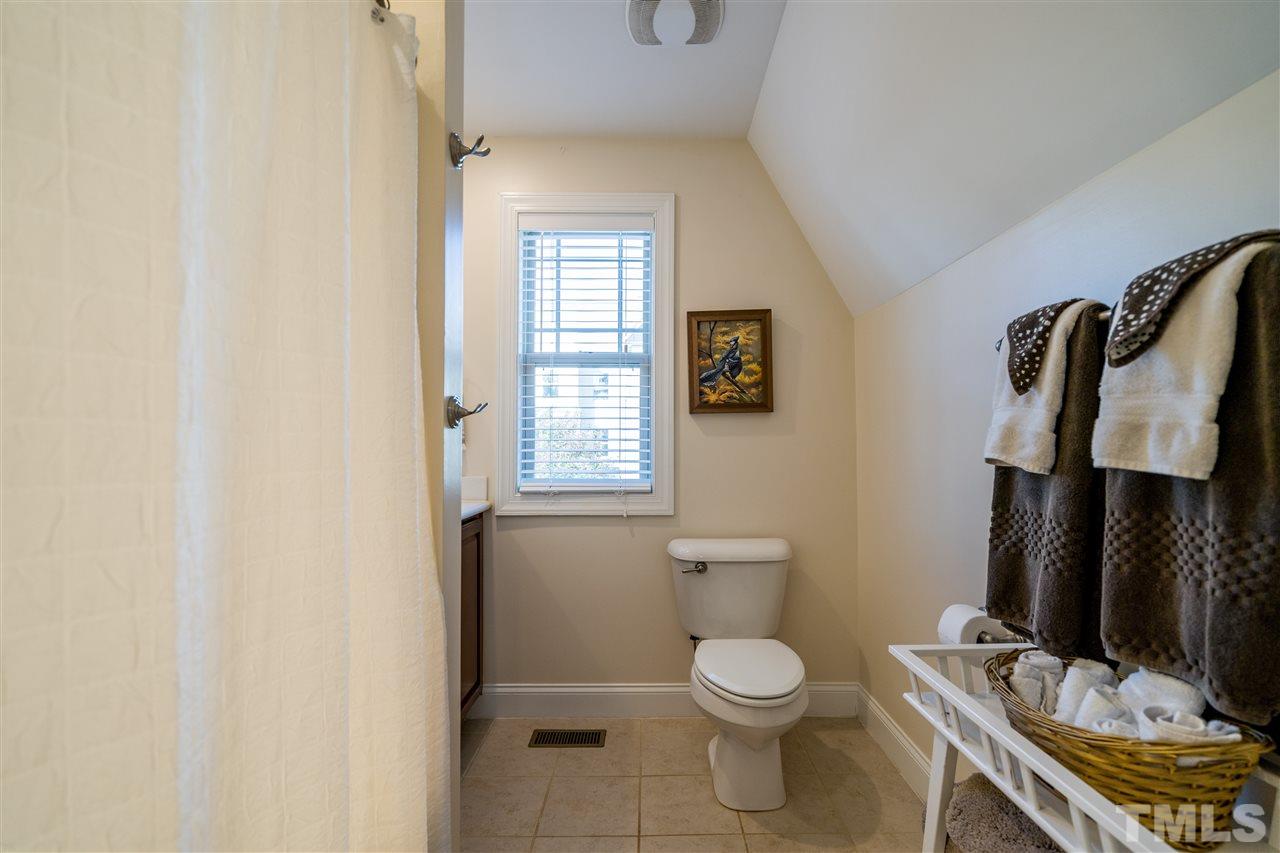 1528 Rodessa Run Raleigh, NC 27607 - Photo 19 of 30 Two secondary bedrooms upstairs share this hall bathroom with a tub/shower and ceramic tile.