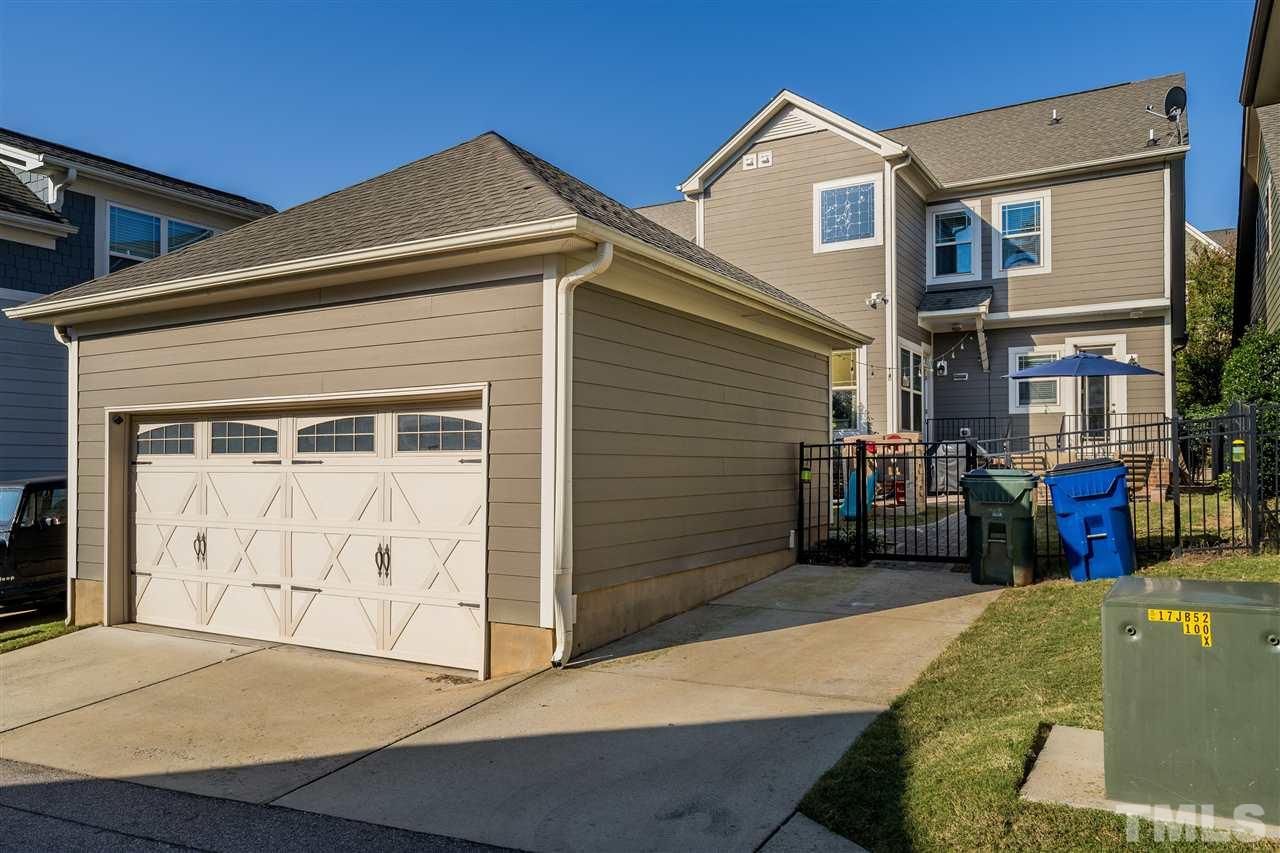1528 Rodessa Run Raleigh, NC 27607 - Photo 29 of 30 Two car detached garage with entrance in the alleyway behind the home.
