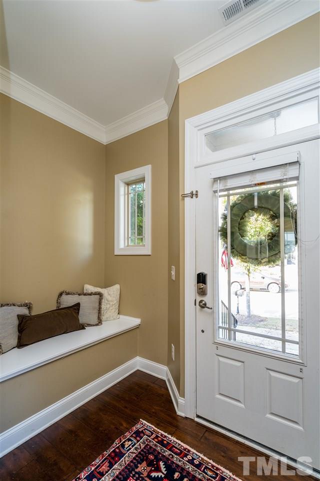 1528 Rodessa Run Raleigh, NC 27607 - Photo 4 of 30 Cozy front foyer gives you the opportunity to greet guests and use your built in bench as a mudroom.