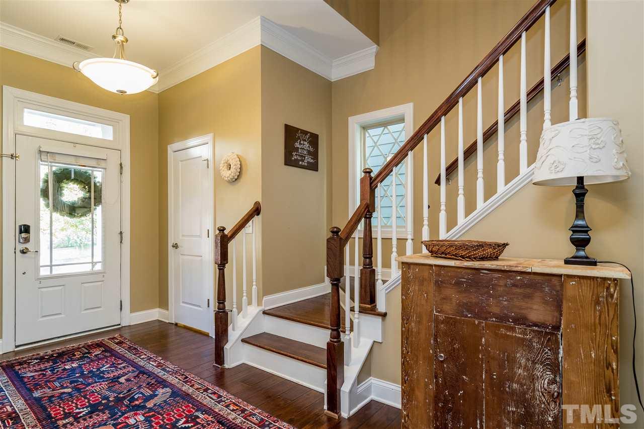 1528 Rodessa Run Raleigh, NC 27607 - Photo 5 of 30 Hardwood steps turn at the foyer for a classic entrance.