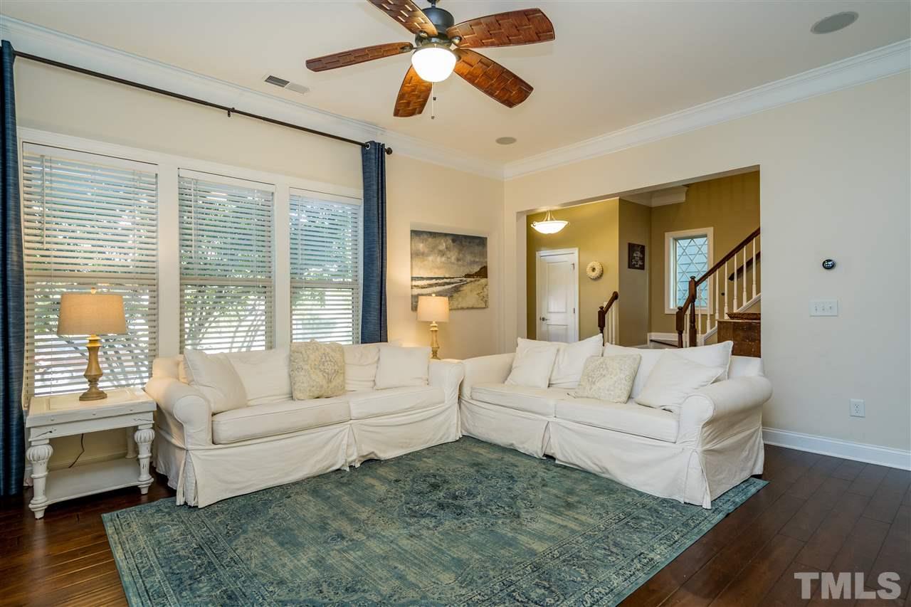 1528 Rodessa Run Raleigh, NC 27607 - Photo 8 of 30 Natural gas fireplace, custom cabinets, hardwoods, 10' ceilings and two piece crown molding.