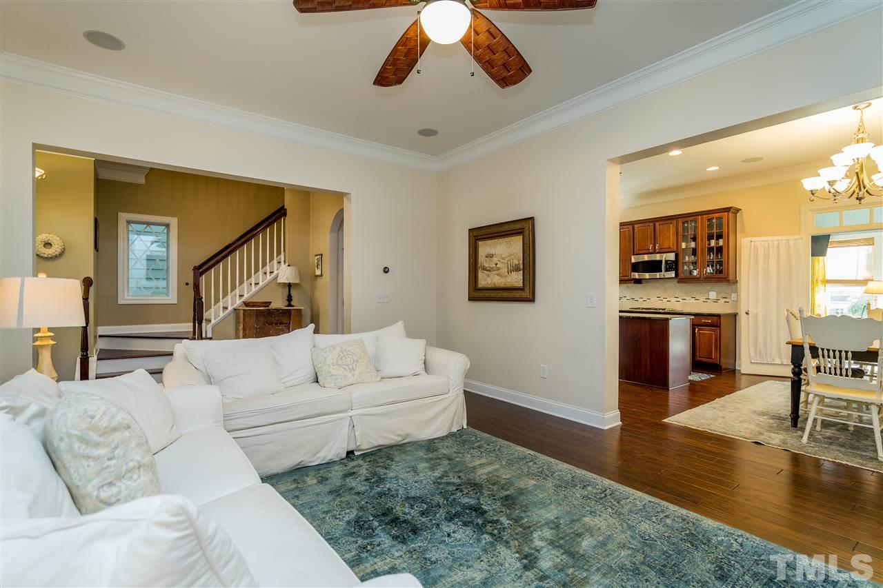 1528 Rodessa Run Raleigh, NC 27607 - Photo 10 of 30 Natural gas fireplace, custom cabinets, hardwoods, 10' ceilings and two piece crown molding.