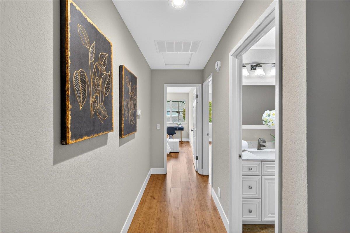 244 Rachael Place Pleasanton, CA 94566 - Photo 12 of 24 a view of a hallway with wooden floor and windows
