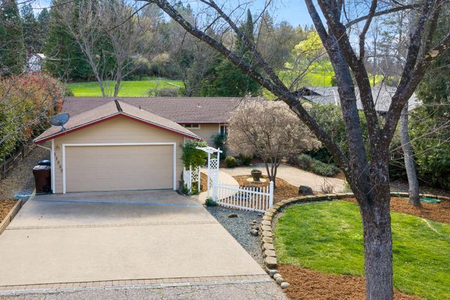a house view with a garden space