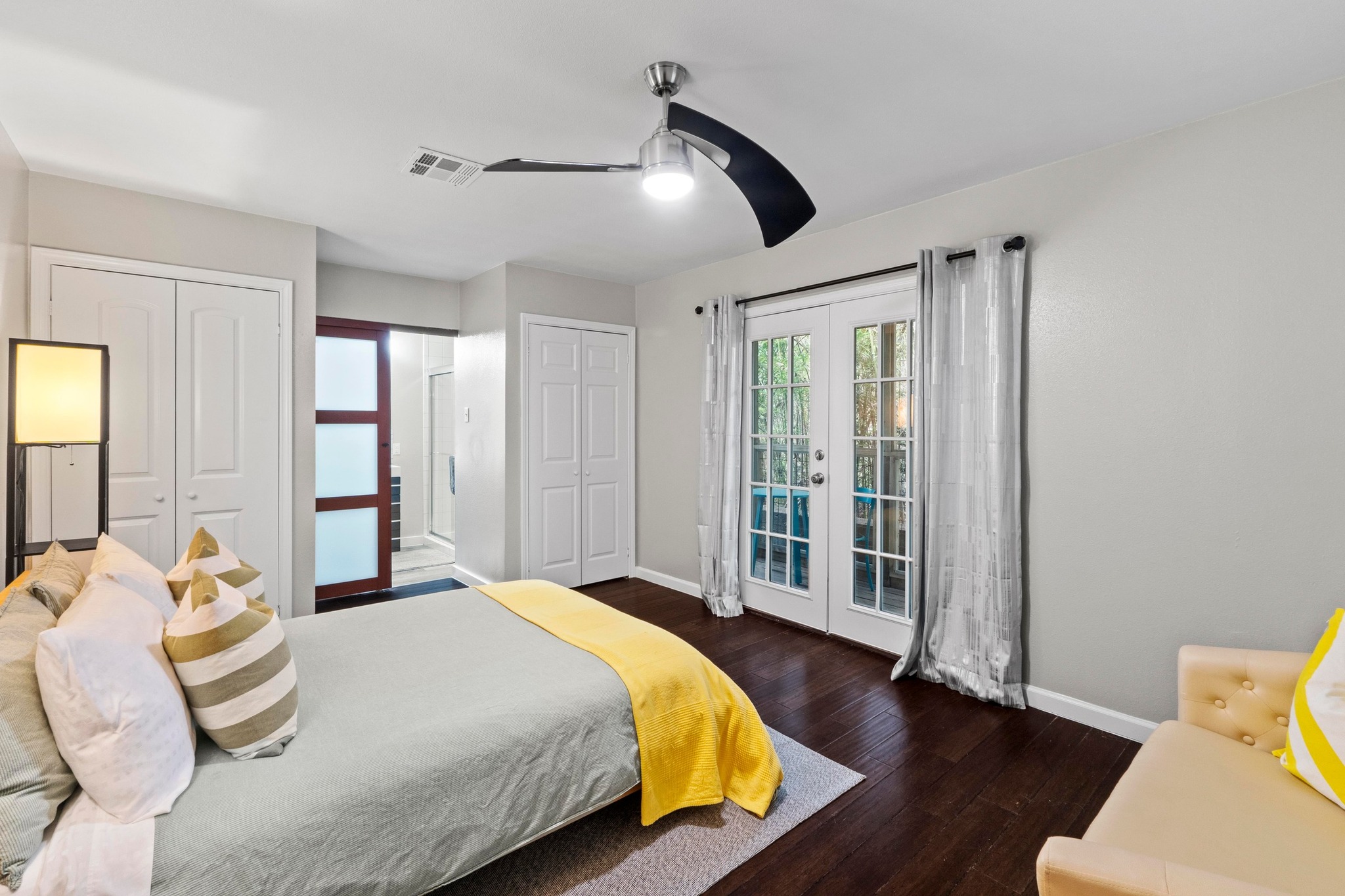 4512 Speedway, Unit A Austin, TX 78751 - Photo 21 of 39 a bedroom with a large bed and a large window