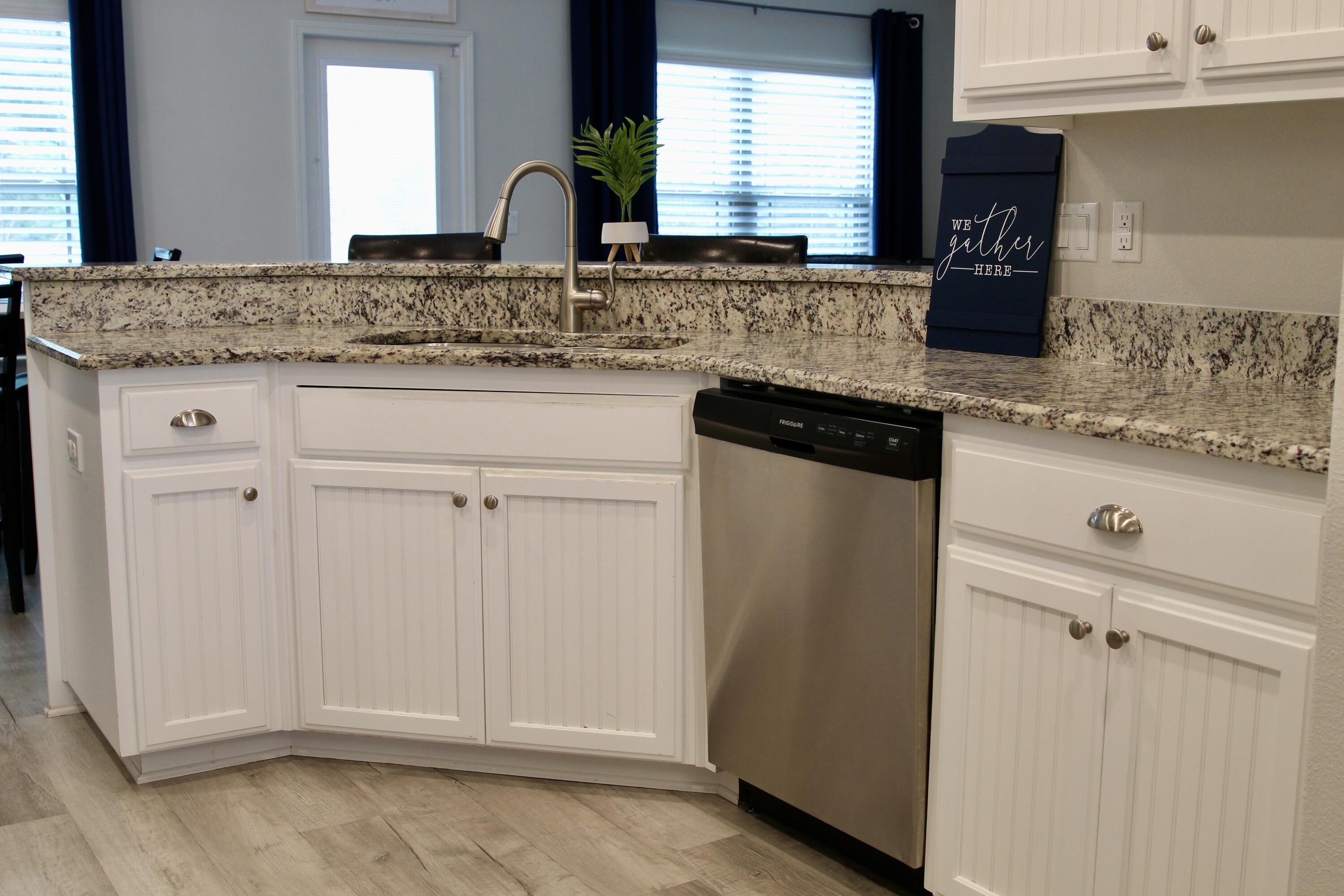 5755 Marigold Loop Crestview, FL 32539 - Photo 23 of 74 a bathroom with granite countertop white cabinets and a sink