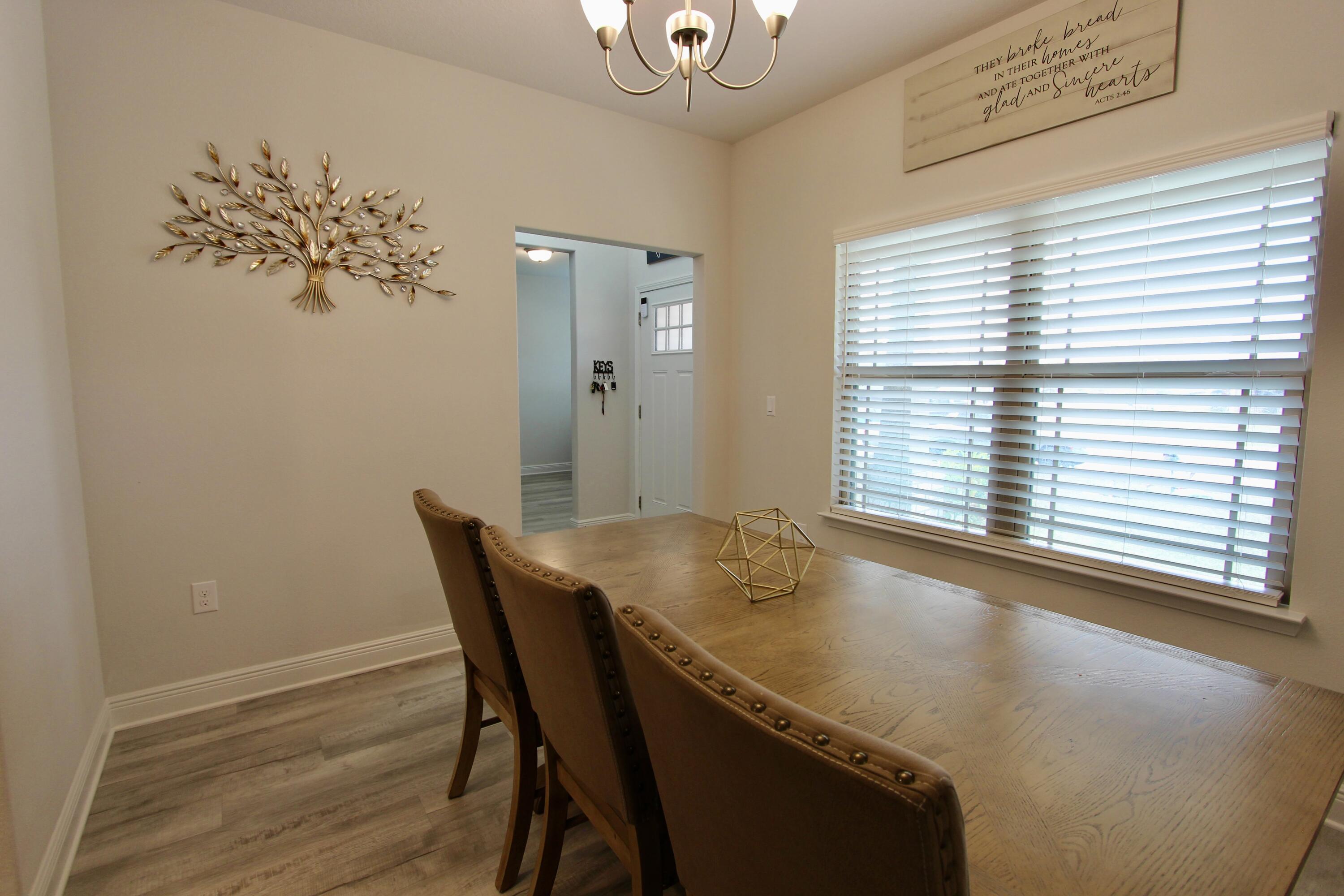 5755 Marigold Loop Crestview, FL 32539 - Photo 30 of 74 a view of a dining room with furniture and window