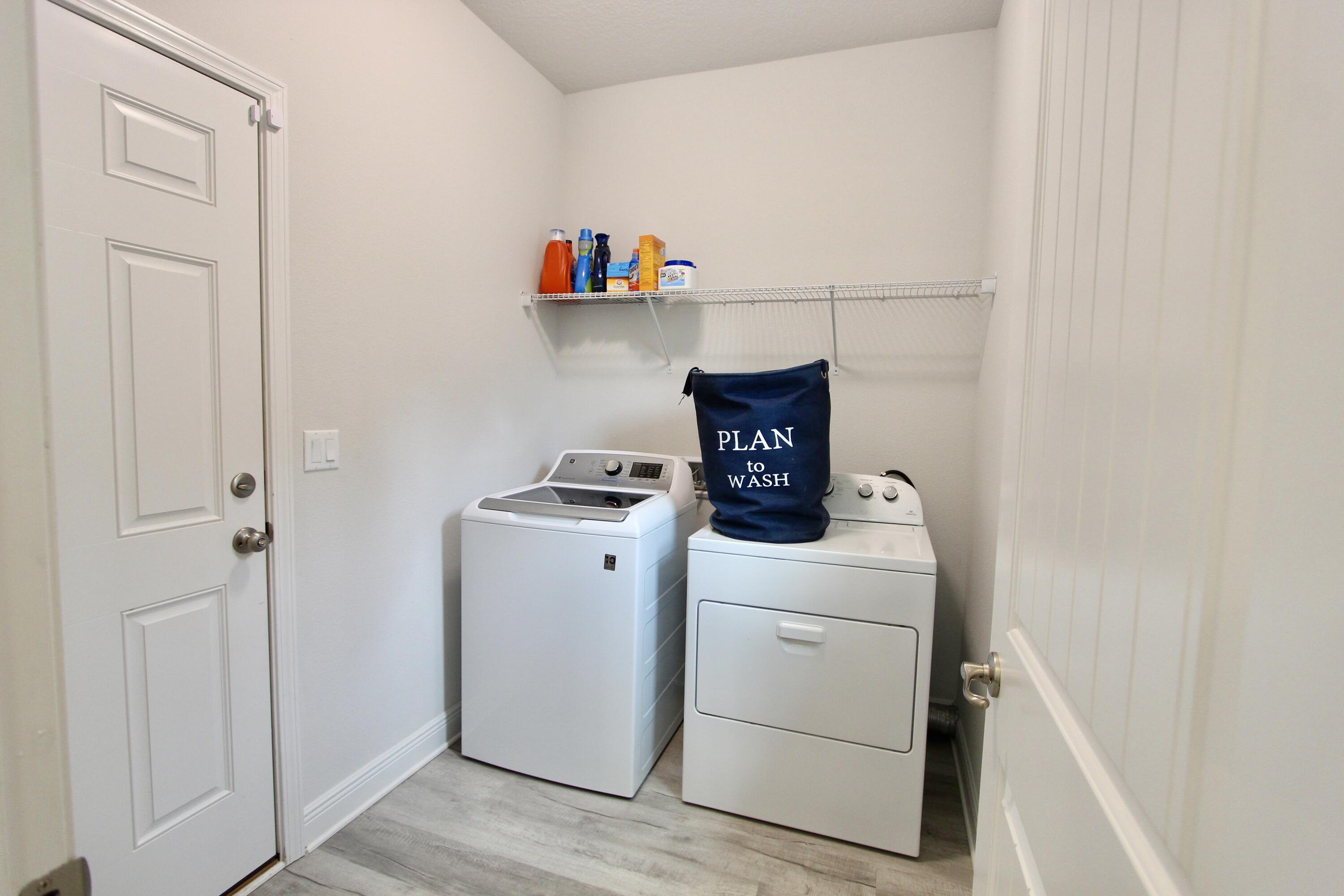 5755 Marigold Loop Crestview, FL 32539 - Photo 35 of 74 a view of storage and utility room with washer and dryer