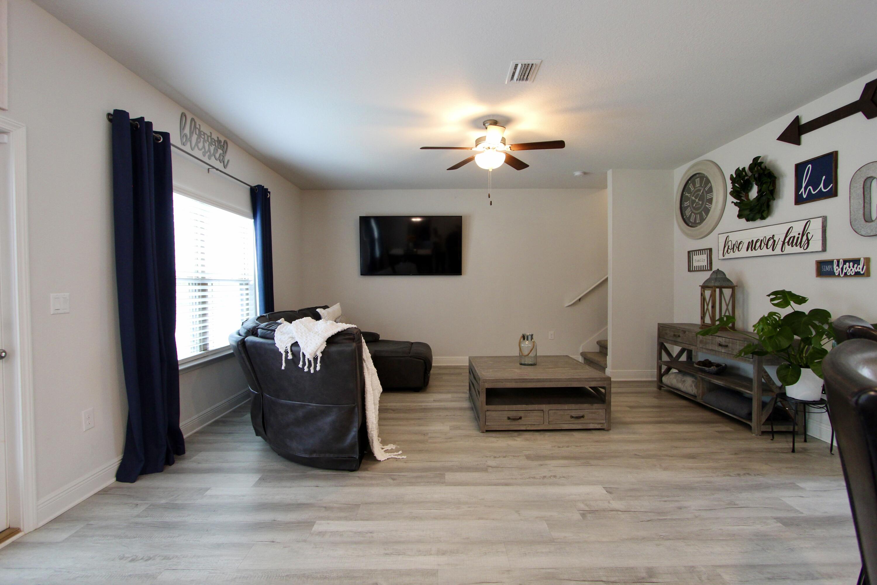 5755 Marigold Loop Crestview, FL 32539 - Photo 38 of 74 a living room with furniture and a flat screen tv
