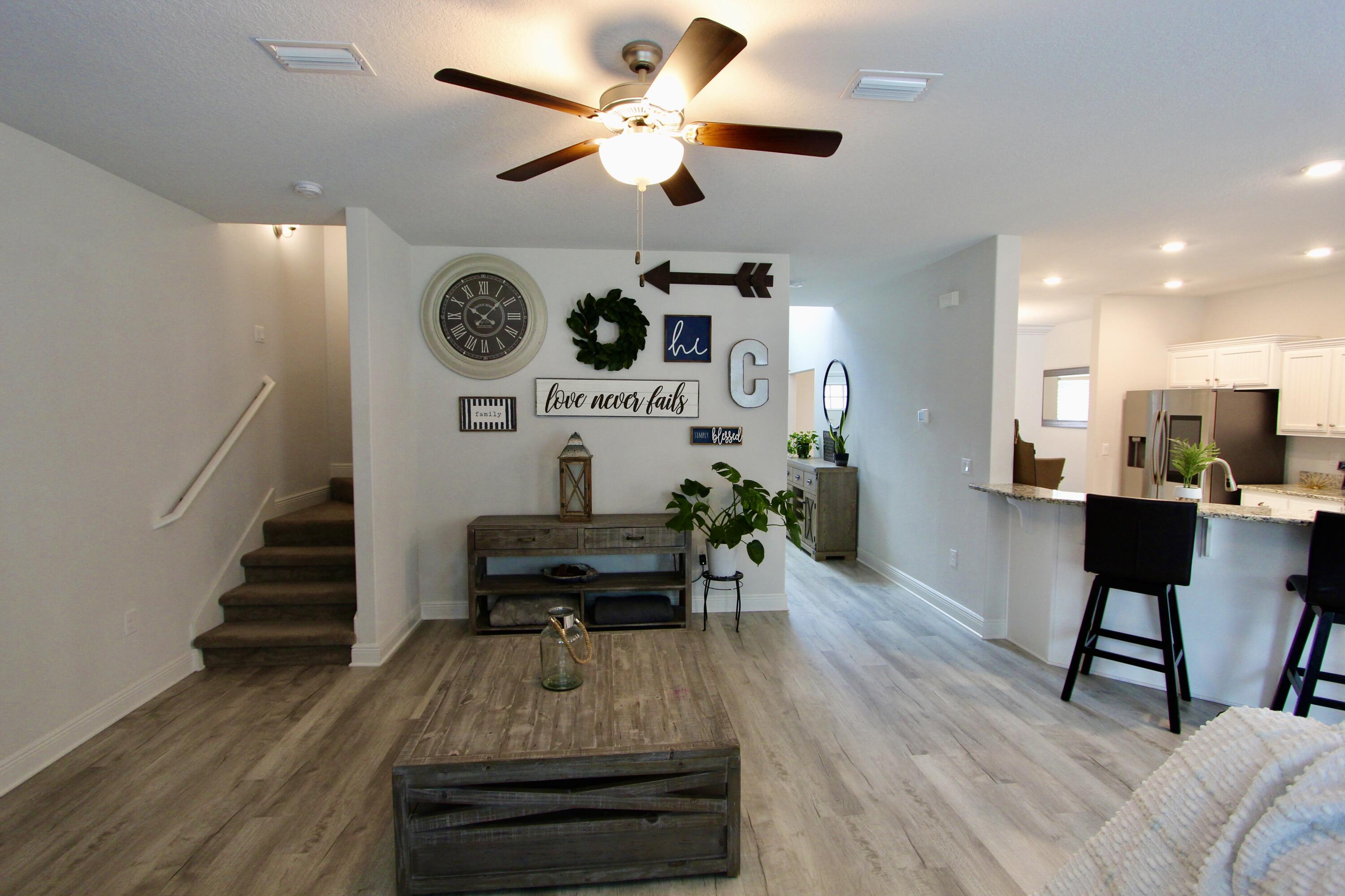 5755 Marigold Loop Crestview, FL 32539 - Photo 41 of 74 a living room with furniture and a wooden floor