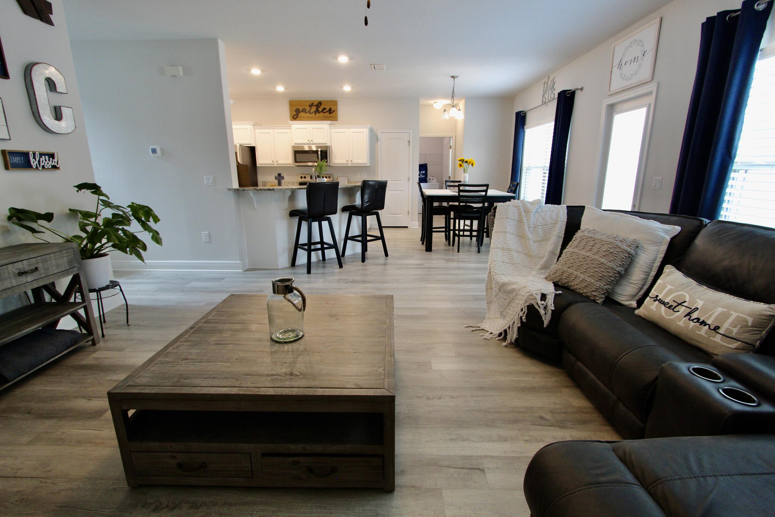 5755 Marigold Loop Crestview, FL 32539 - Photo 44 of 74 a living room with furniture and wooden floor