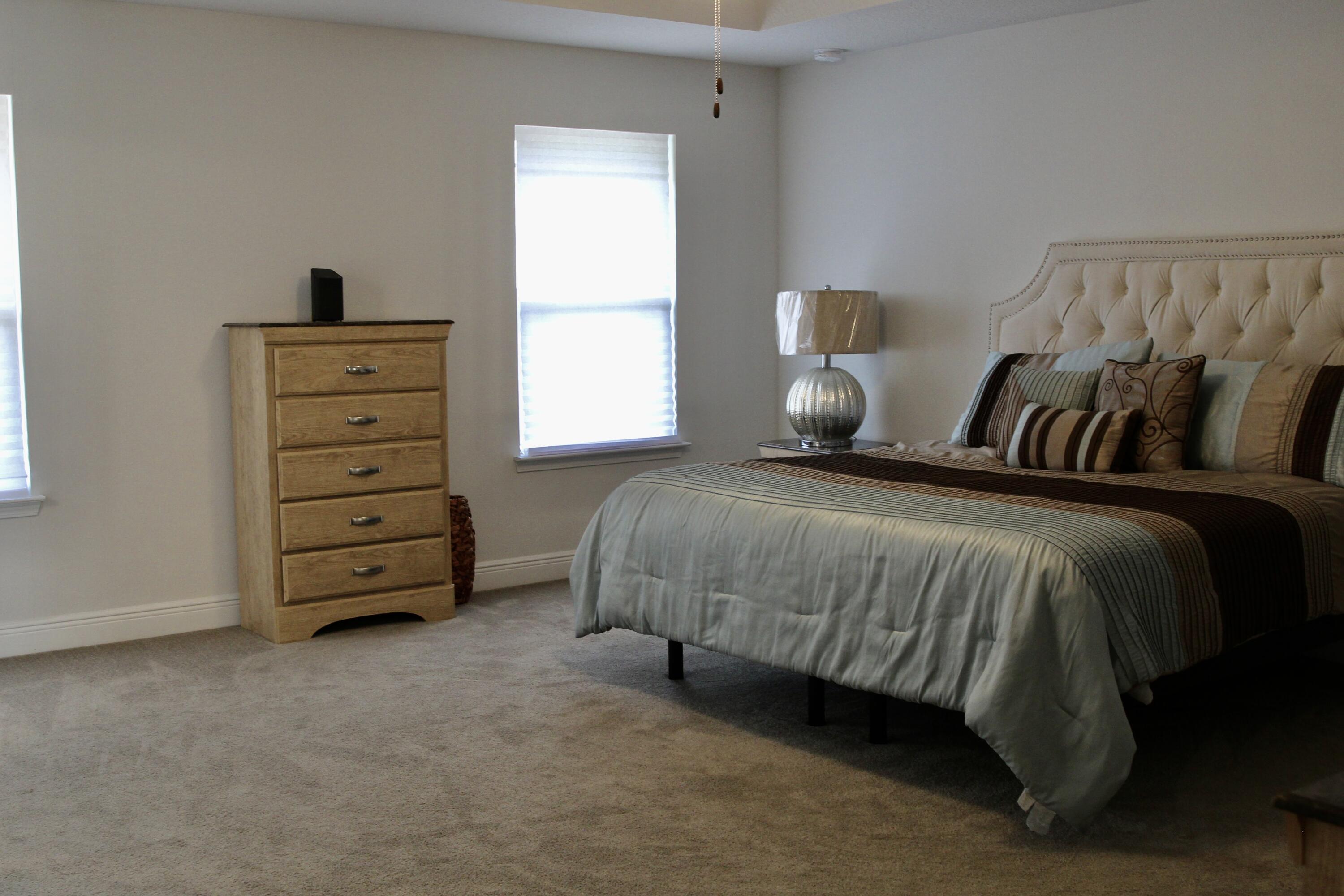 5755 Marigold Loop Crestview, FL 32539 - Photo 47 of 74 a bedroom with a bed and a window