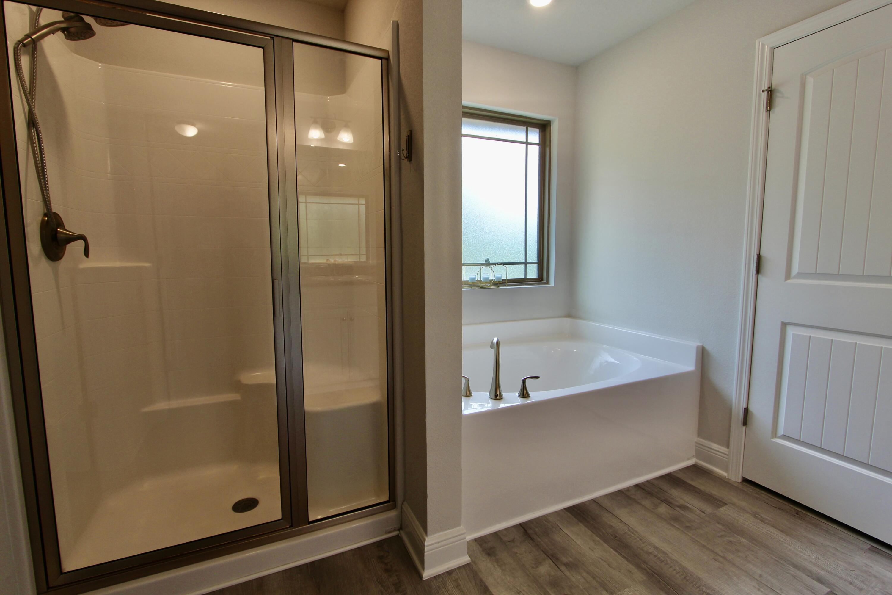 5755 Marigold Loop Crestview, FL 32539 - Photo 55 of 74 a bathroom with a tub shower and sink