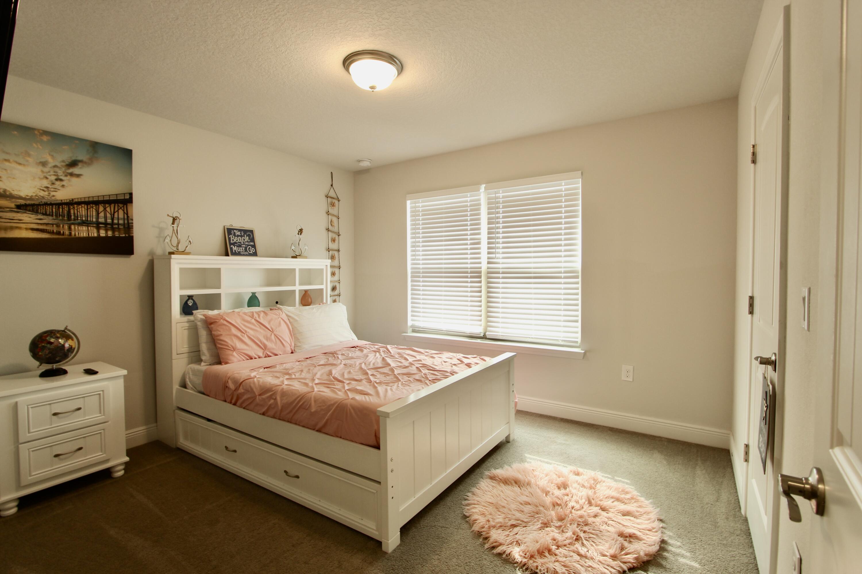 5755 Marigold Loop Crestview, FL 32539 - Photo 60 of 74 a bedroom with a bed and a window