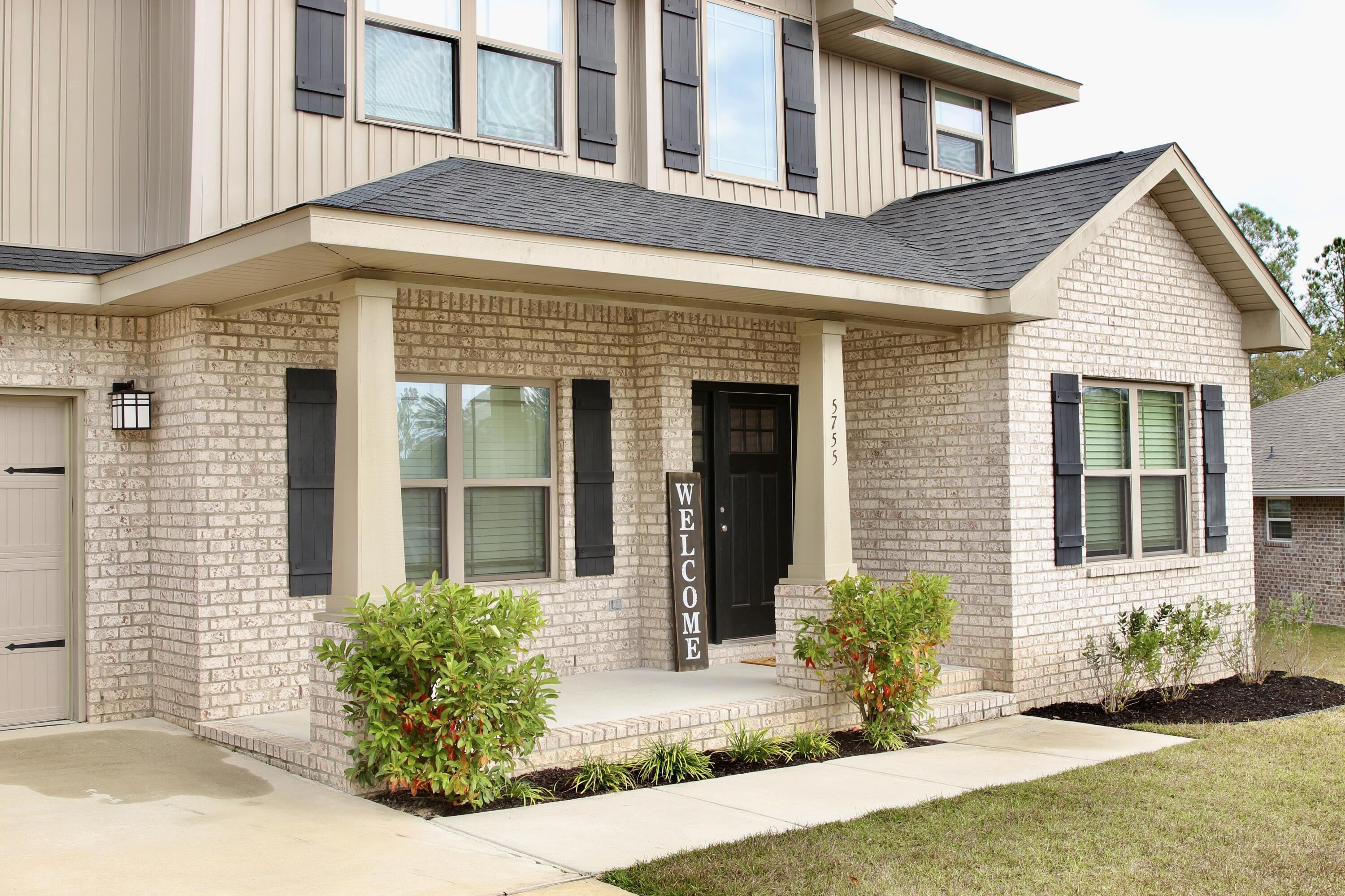 5755 Marigold Loop Crestview, FL 32539 - Photo 7 of 74 a front view of a house with yard
