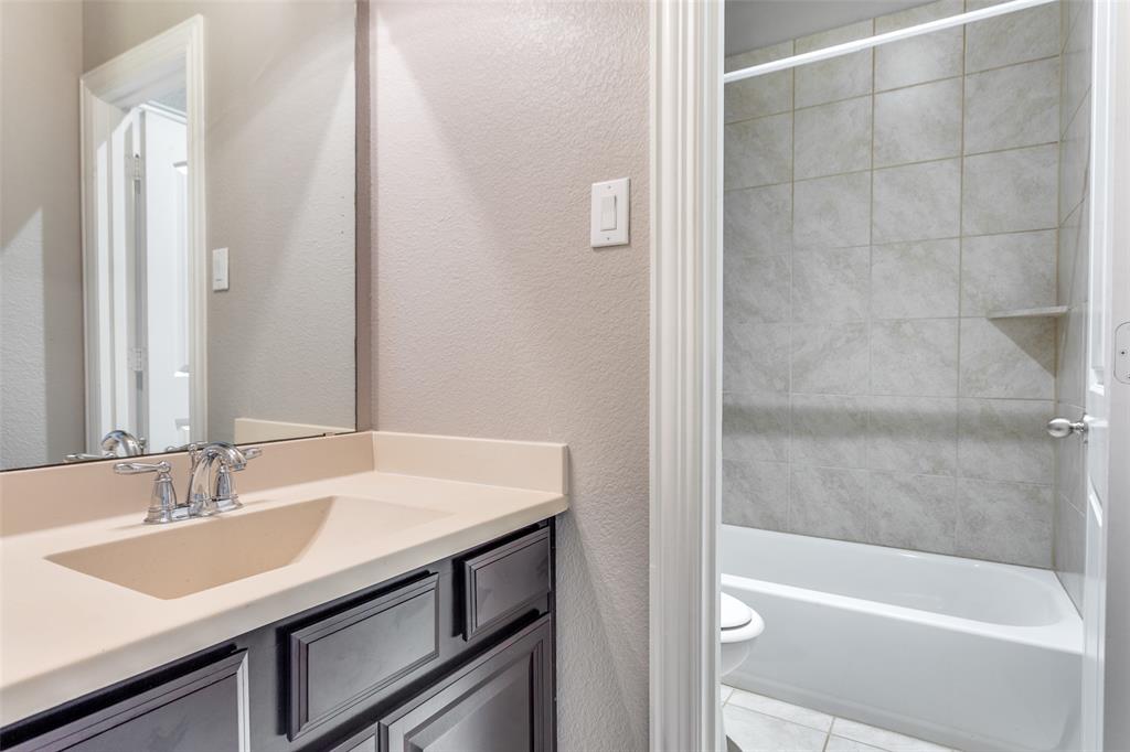 1505 5th Street Argyle, TX 76226 - Photo 23 of 25 a bathroom with a sink and a bathtub