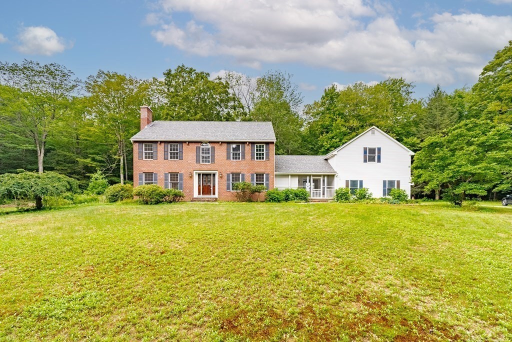 218 N Road Westhampton, MA 01027 - Photo 2 of 42 a front view of a house with a garden