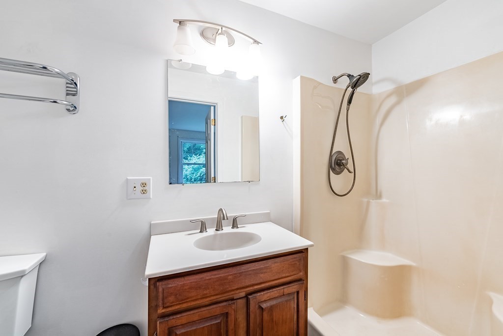 218 N Road Westhampton, MA 01027 - Photo 29 of 42 a bathroom with a sink vanity mirror and toilet