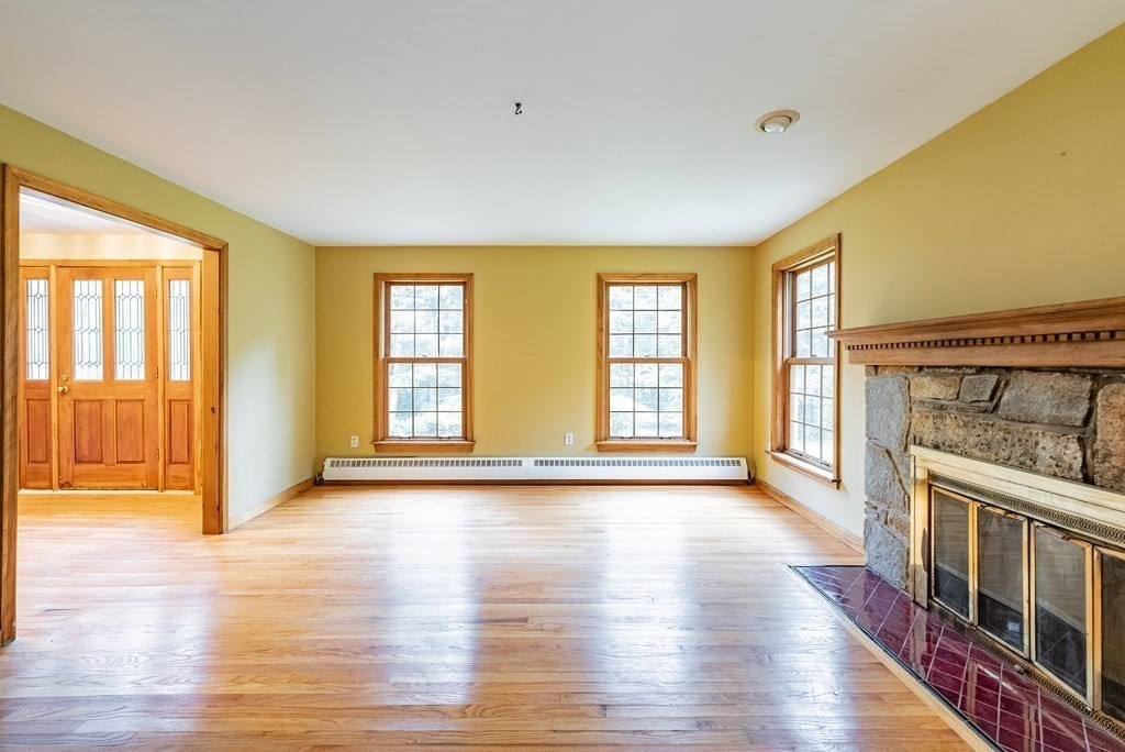 218 N Road Westhampton, MA 01027 - Photo 6 of 42 a view of an empty room with glass door and wooden floor