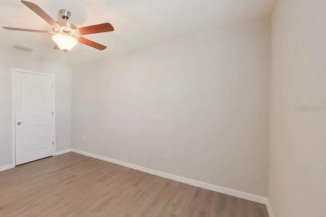 a view of a small space with wooden floor