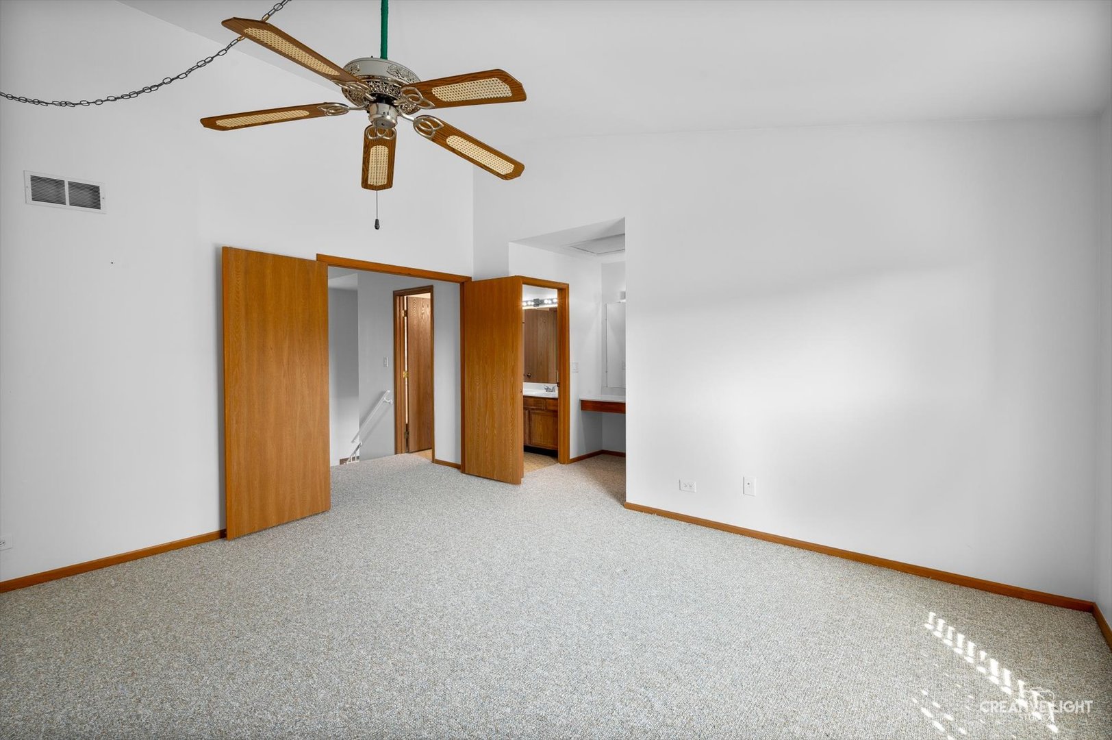 7419 Canterbury Place Downers Grove, IL 60516 - Photo 13 of 17 a view of an empty room with a ceiling fan