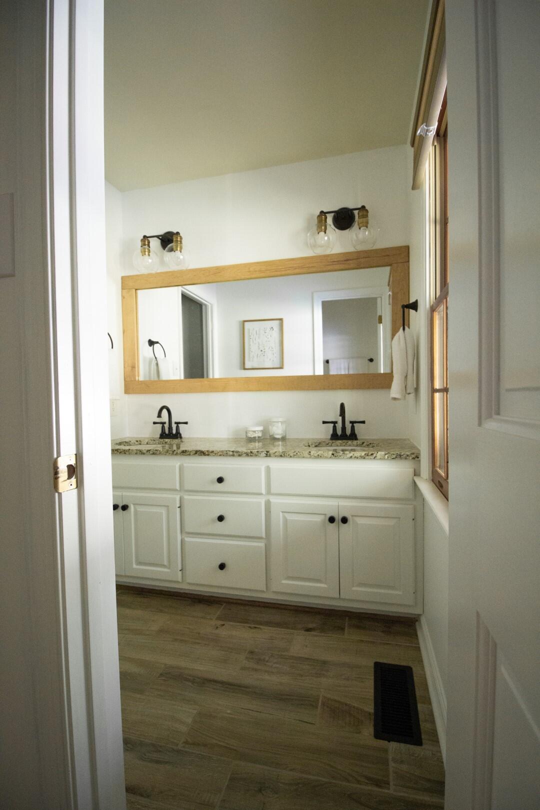 2420 Roaring Run Road Goode, VA 24556 - Photo 2 of 53 a bathroom with a sink vanity granite and a mirror