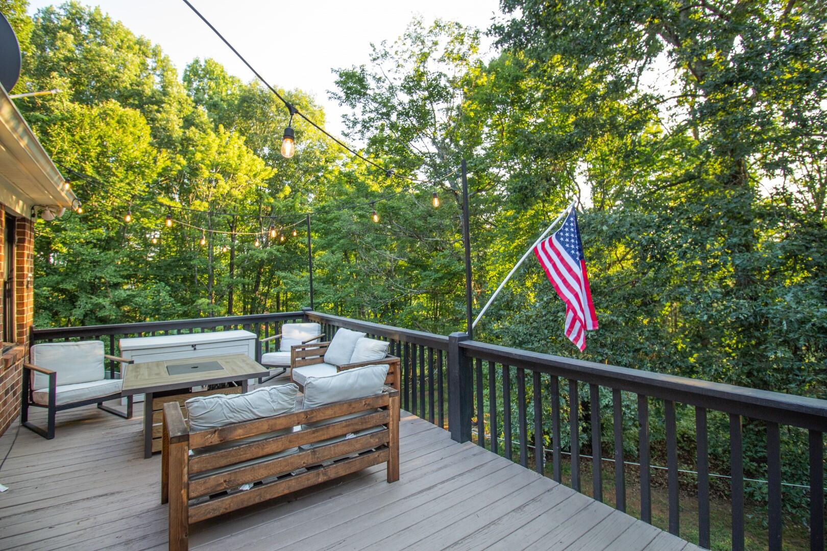 2420 Roaring Run Road Goode, VA 24556 - Photo 16 of 53 a view of sitting area with furniture and wooden deck