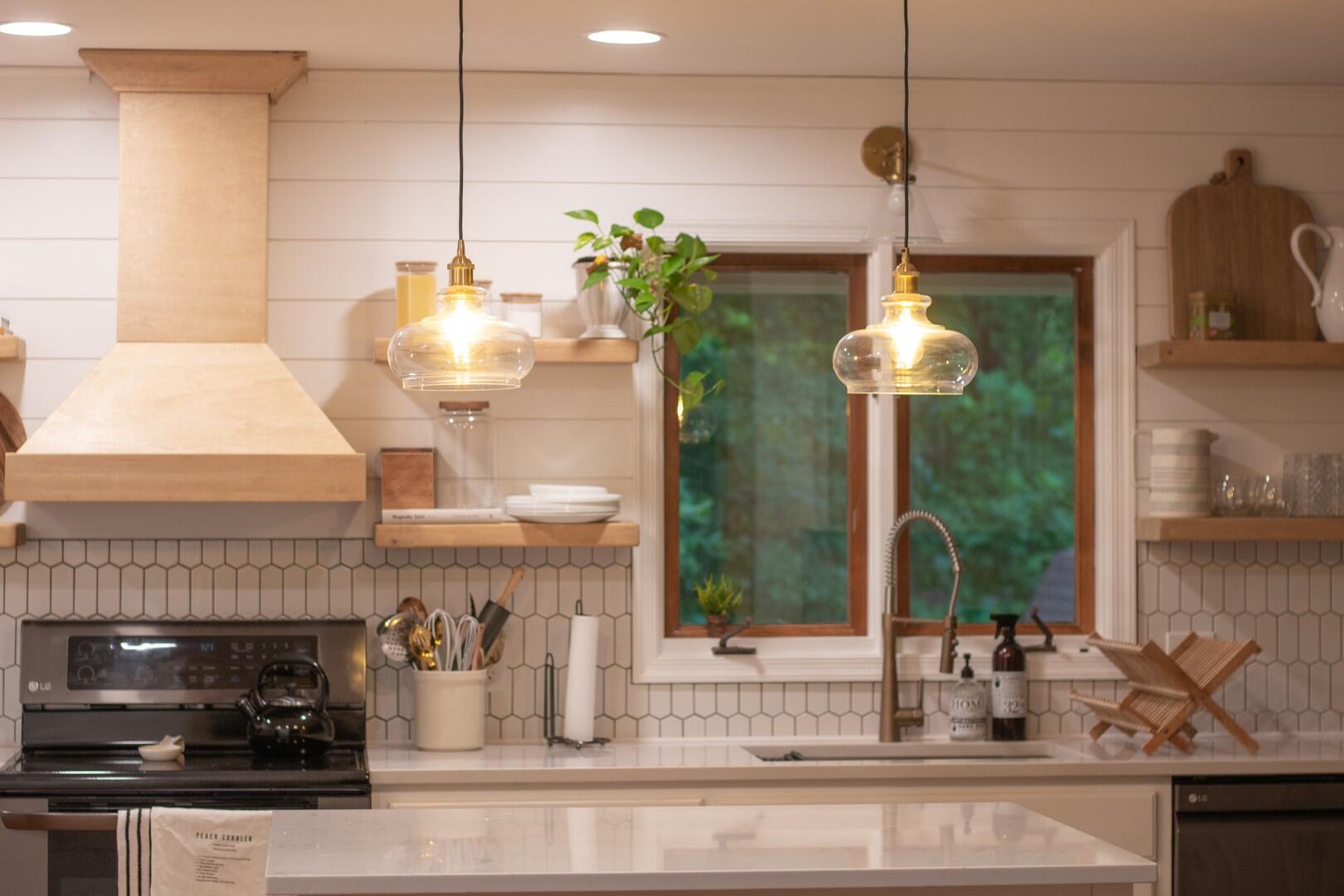 2420 Roaring Run Road Goode, VA 24556 - Photo 22 of 53 a kitchen with a sink and chandelier