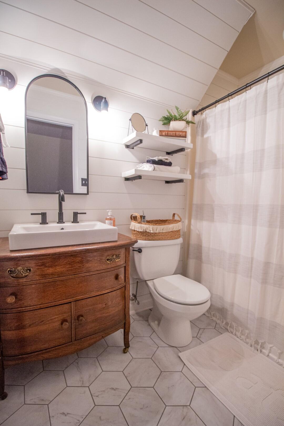 2420 Roaring Run Road Goode, VA 24556 - Photo 25 of 53 a bathroom with a toilet sink and mirror