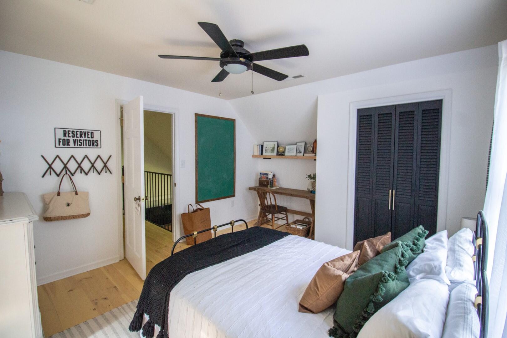 2420 Roaring Run Road Goode, VA 24556 - Photo 27 of 53 a bedroom with a bed and a chandelier