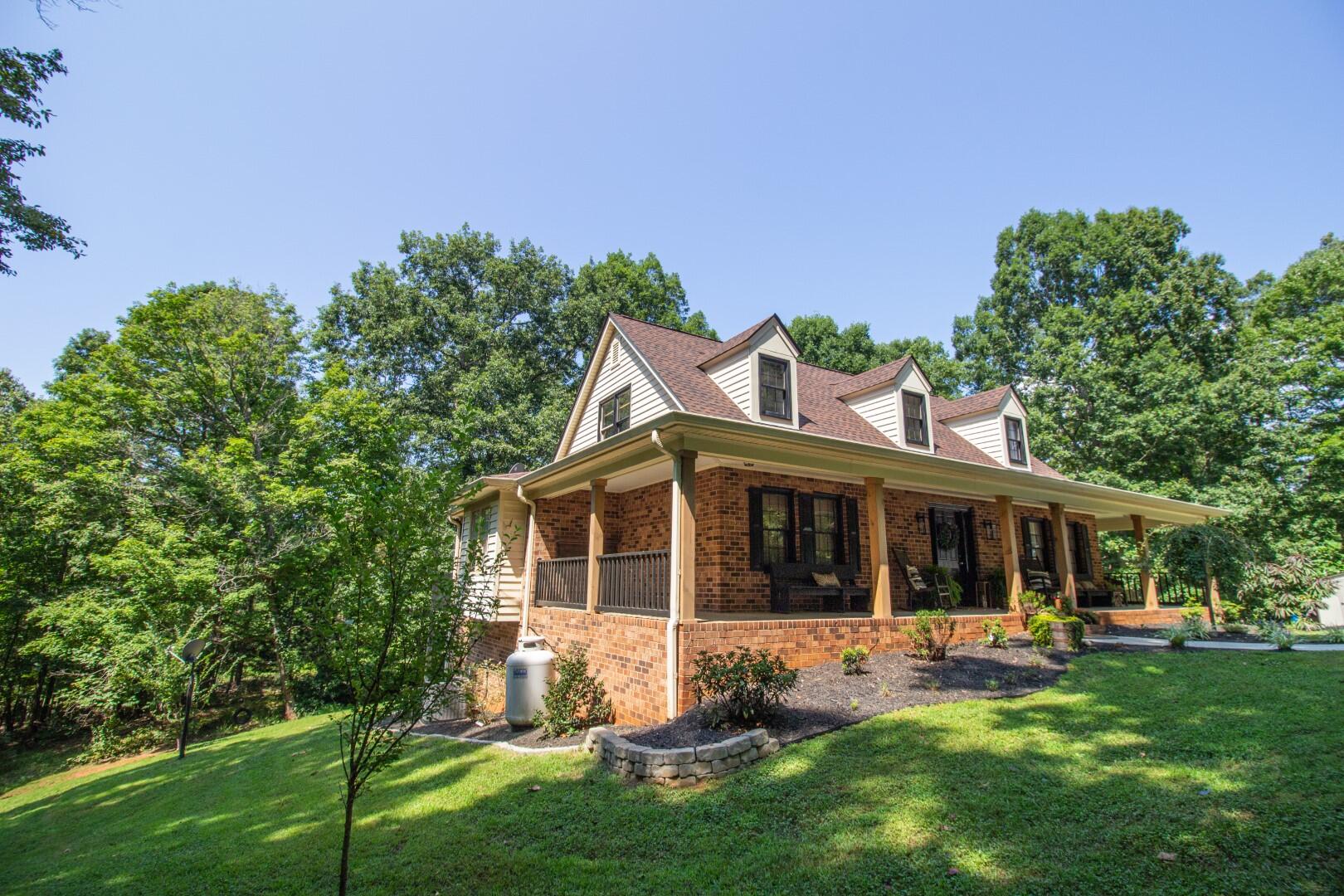 2420 Roaring Run Road Goode, VA 24556 - Photo 33 of 53 a view of a house with a yard and sitting area
