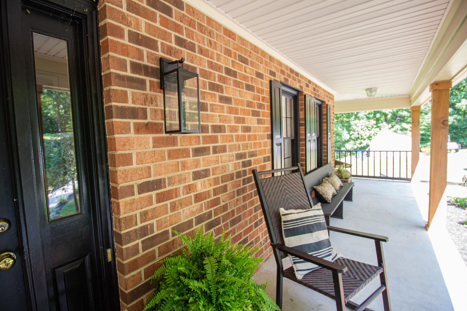2420 Roaring Run Road Goode, VA 24556 - Photo 34 of 53 a view of a chairs and table in a patio